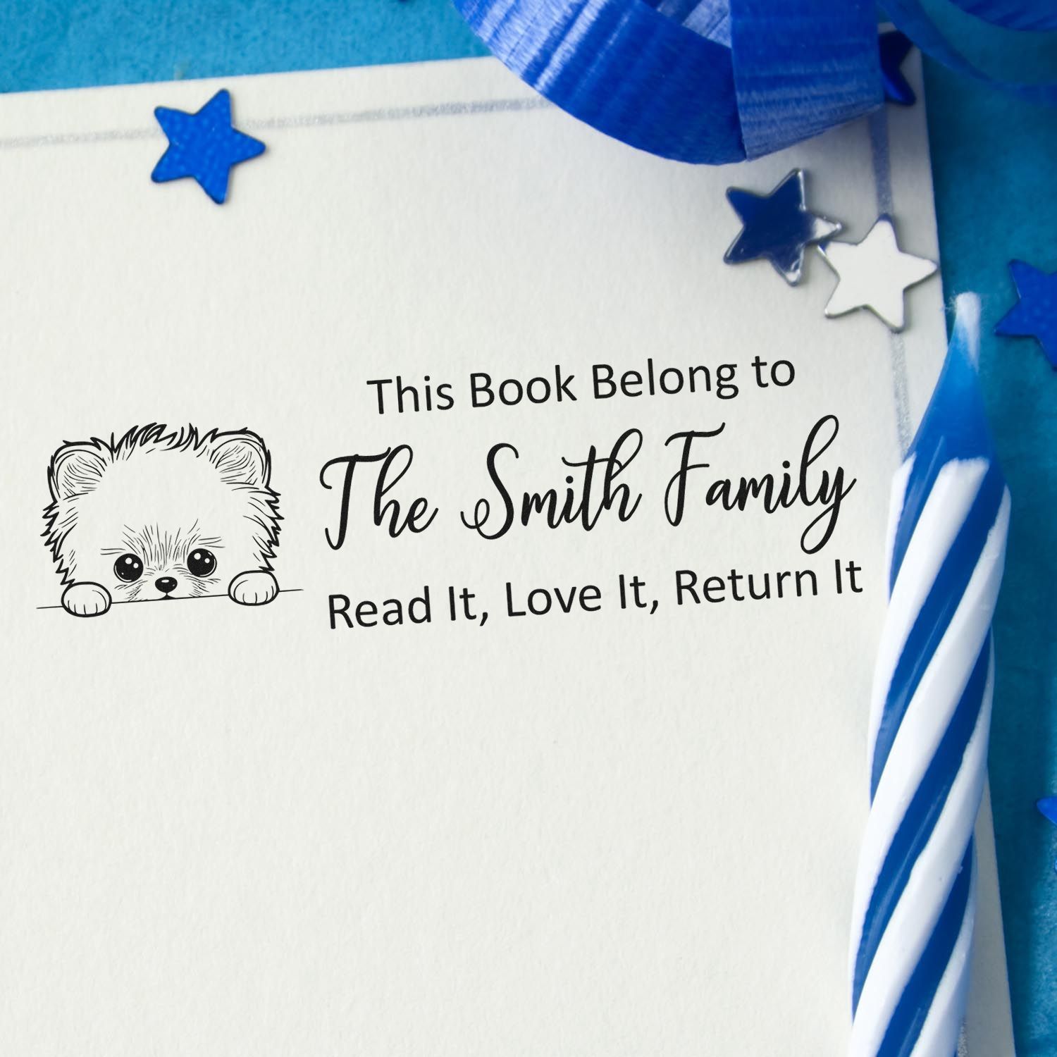 Custom personalized book rubber stamp with bear design, featuring The Smith Family return-it text.