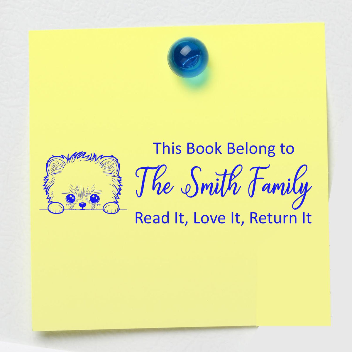 Personalized book ownership rubber stamp with puppy art and family name, Read It, Love It, Return It for marking library books.