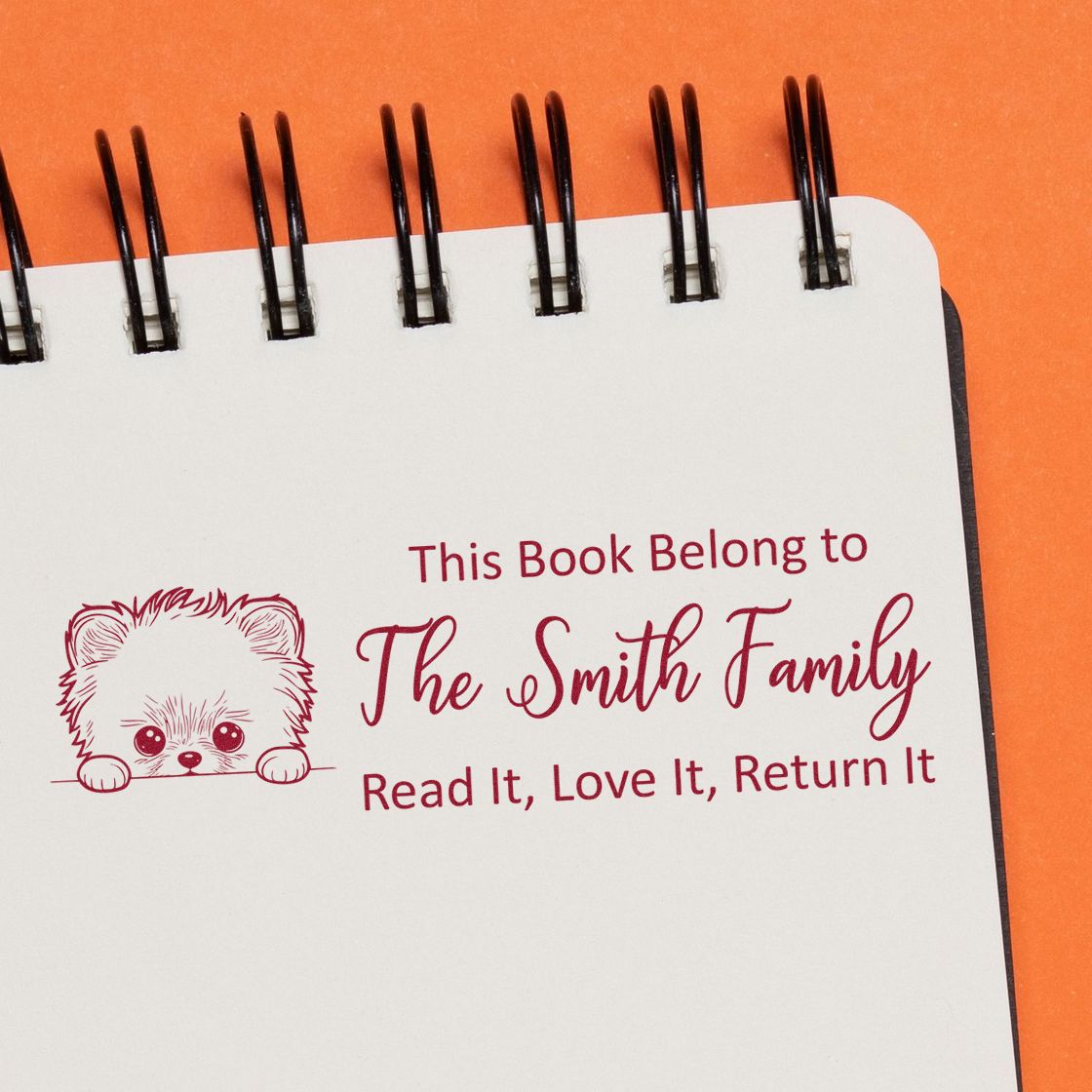 Personalized book rubber stamp with teddy bear design and This Book Belongs to The Smith Family return-it message.