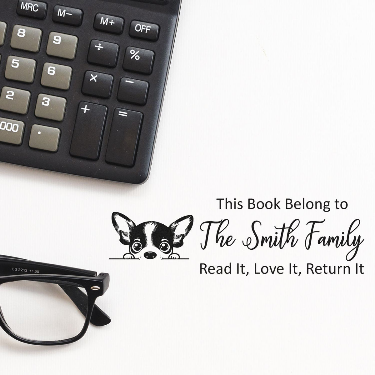 Personalized rubber book stamp for The Smith Family, with dog art and Read It, Love It, Return It library ownership text.