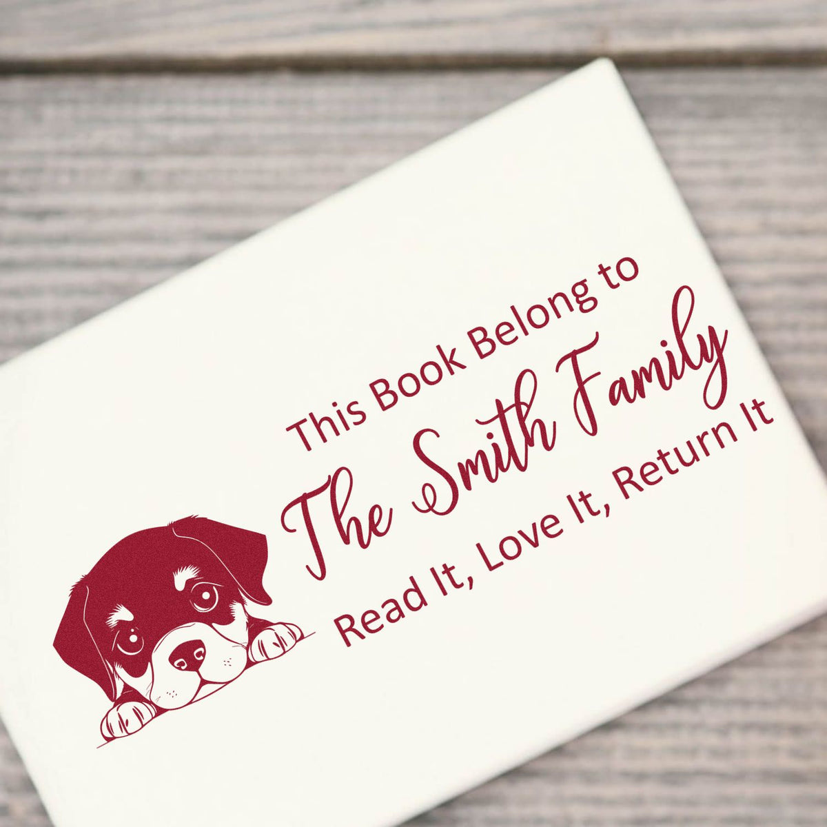 Personalized book stamp with dog illustration and This Book Belongs to The Smith Family return-it message.