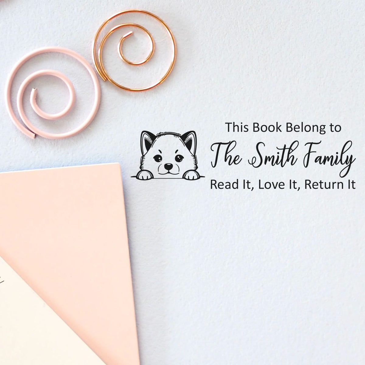 Personalized library book stamp with dog illustration: This Book Belongs to The Smith Family, Read It, Love It, Return It.