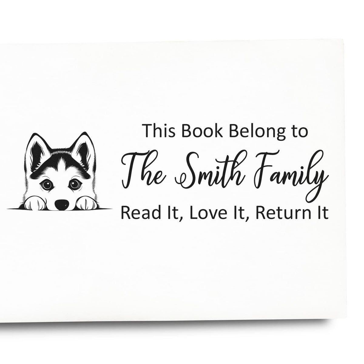 Personalized rubber stamp for books with husky dog art, This Book Belongs to The Smith Family, and return-it message.