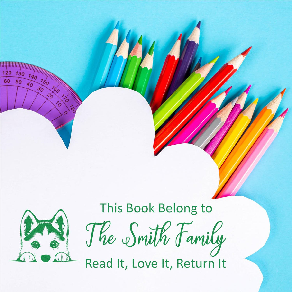 Custom childrens book stamp with dog icon and This Book Belongs to The Smith Family return message.