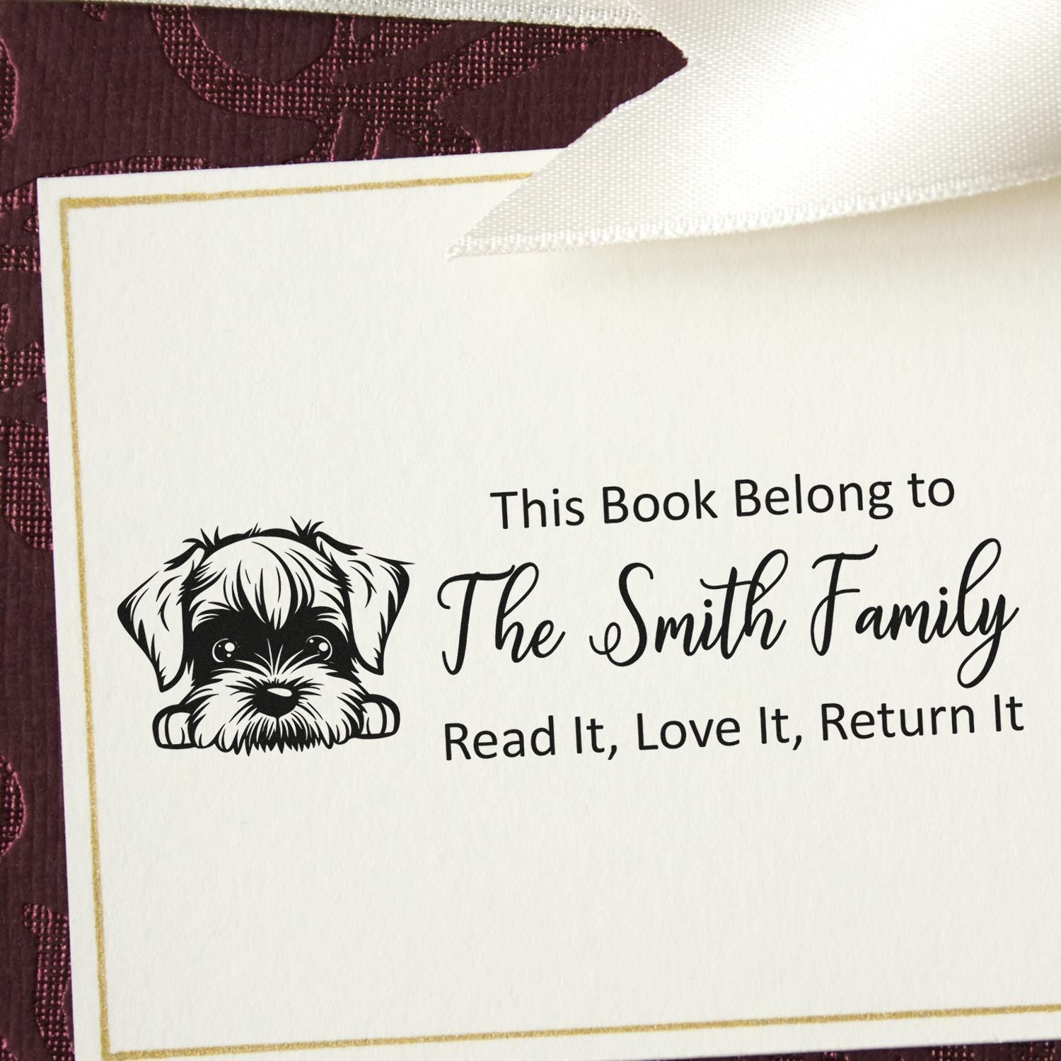 Personalized book return rubber stamp with dog illustration and family name, reading This Book Belong to The Smith Family.