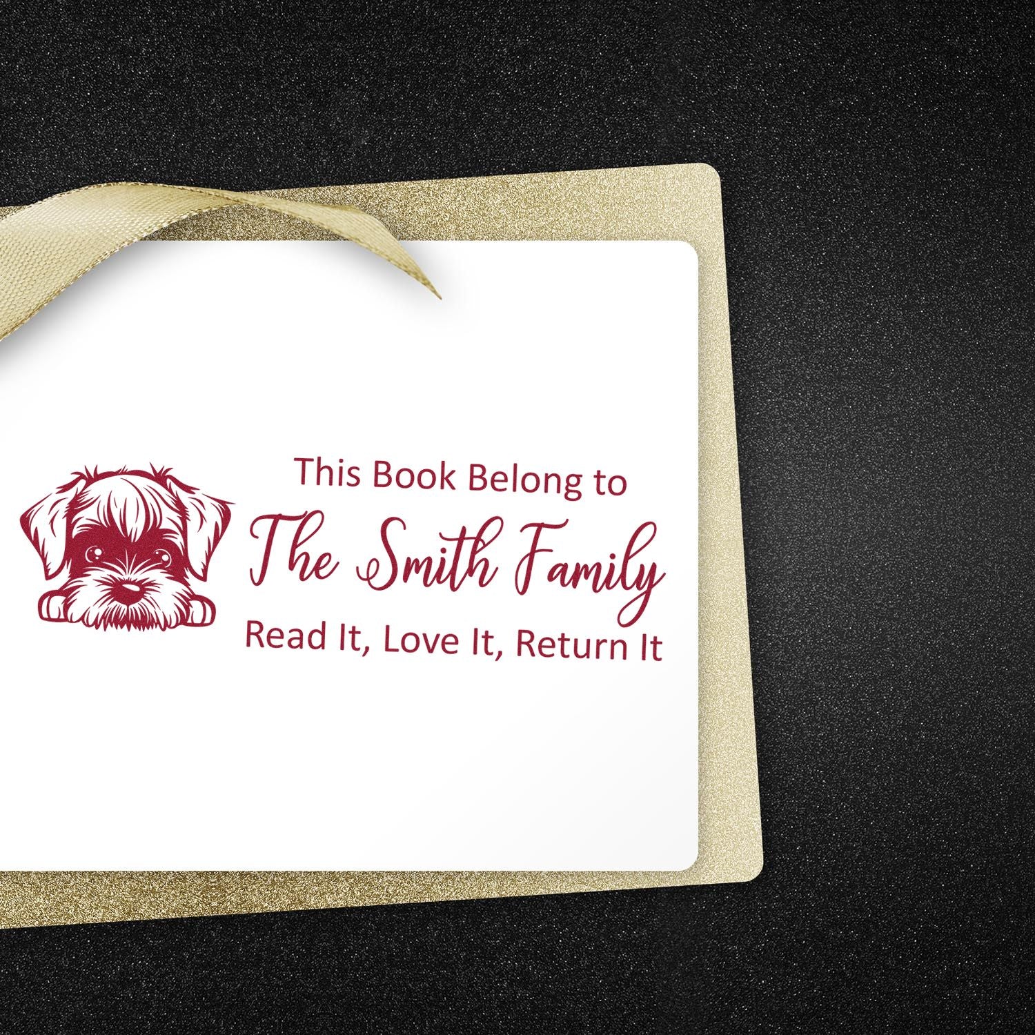 Personalized rubber book stamp with dog design and This Book Belong to The Smith Family return-this-book message.