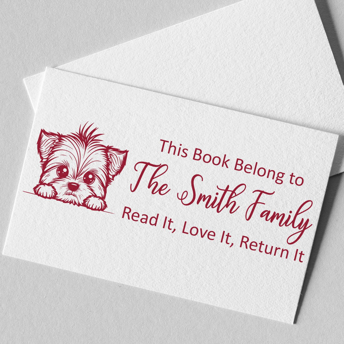 Custom rubber stamp bookplate for The Smith Family with puppy design and Read It, Love It, Return It library message.