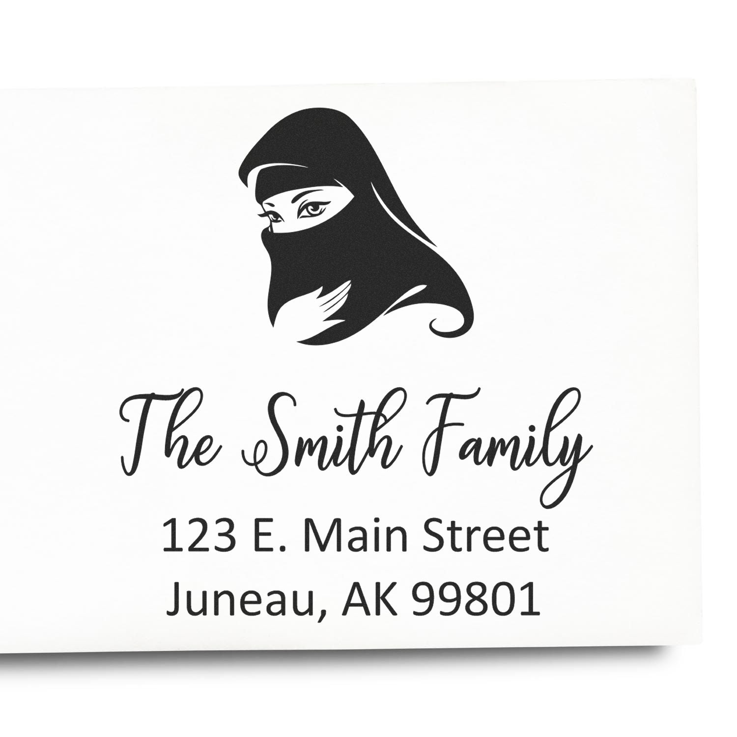 Custom return address rubber stamp with veiled woman logo, The Smith Family, Juneau, AK address.