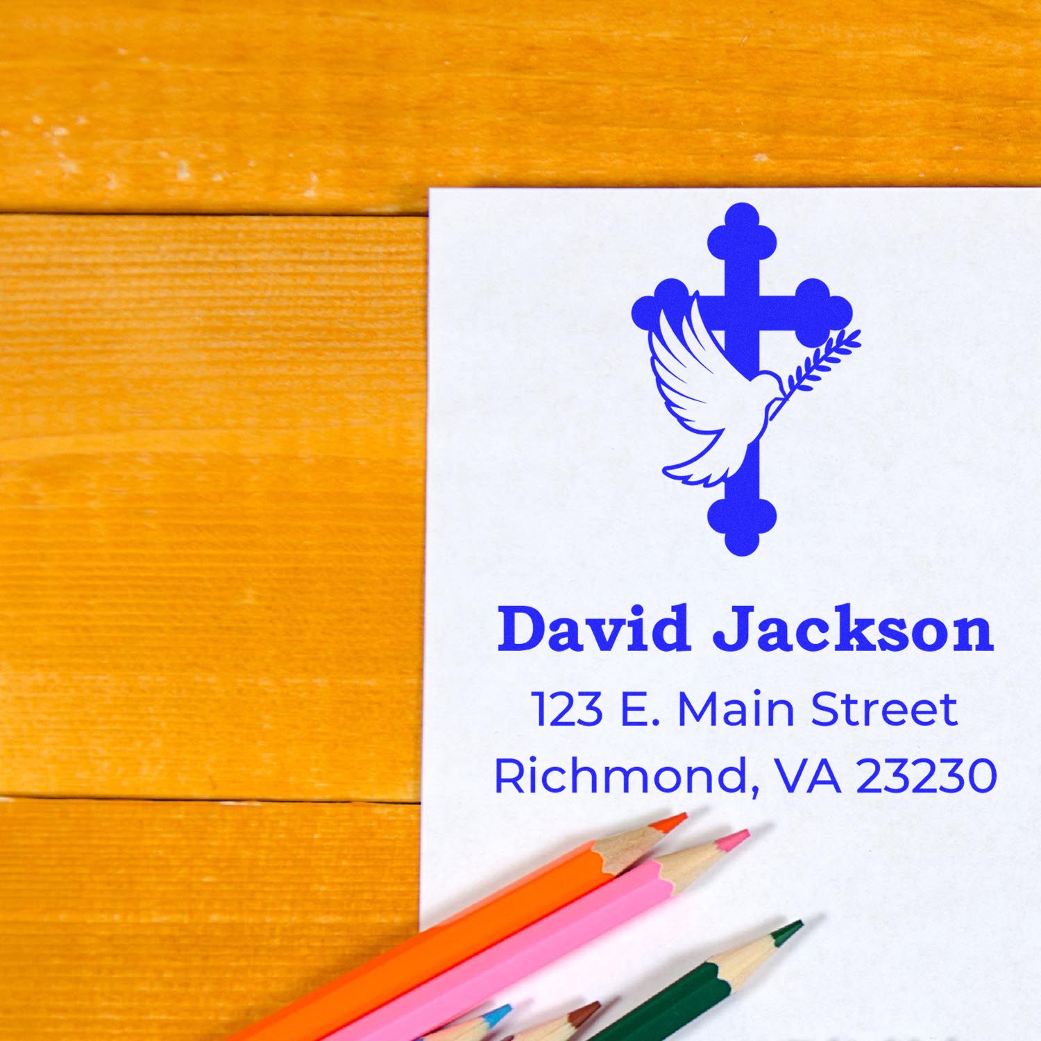 Personalized church return address stamp with dove and cross logo on stationery