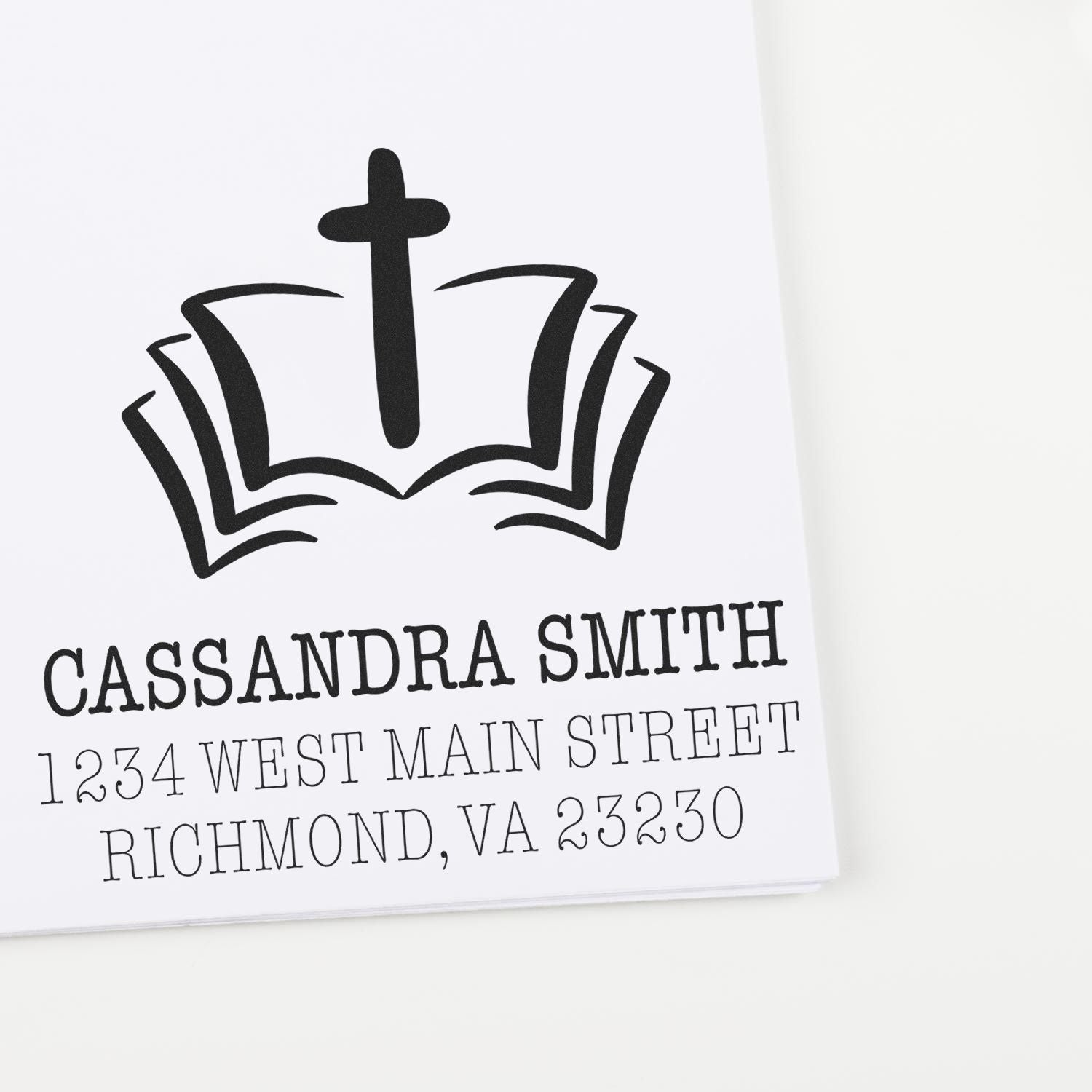 Custom church return address rubber stamp with cross and open Bible logo for envelopes, stationery, and mailing labels.