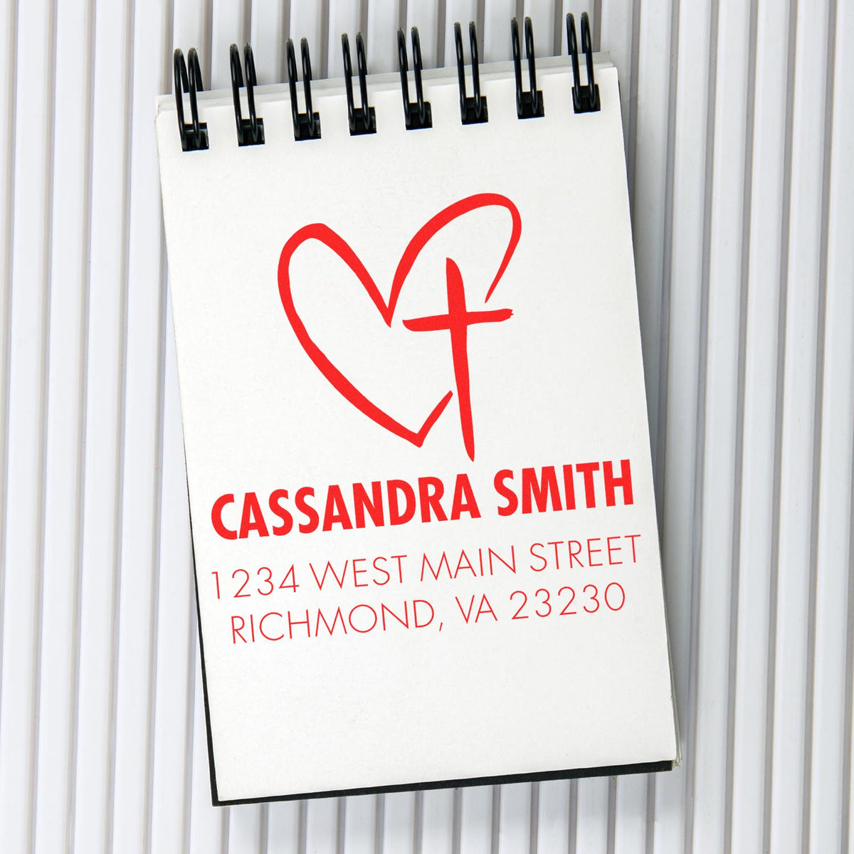 Personalized custom rubber stamp design with heart and cross logo for Cassandra Smith return address, Richmond, VA 23230.