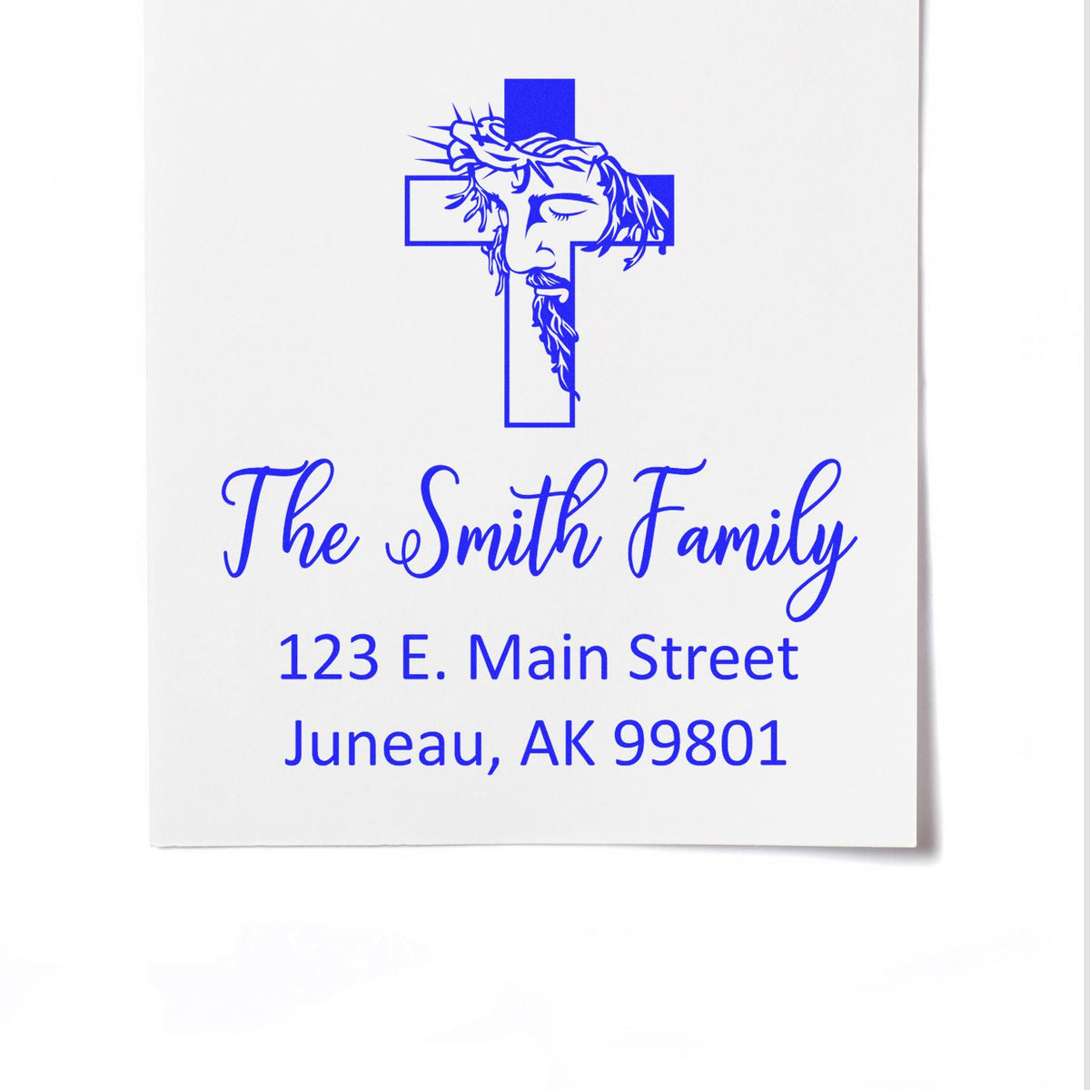 Personalized Christian family address rubber stamp with cross and Jesus design for The Smith Family, Juneau, AK 99801.