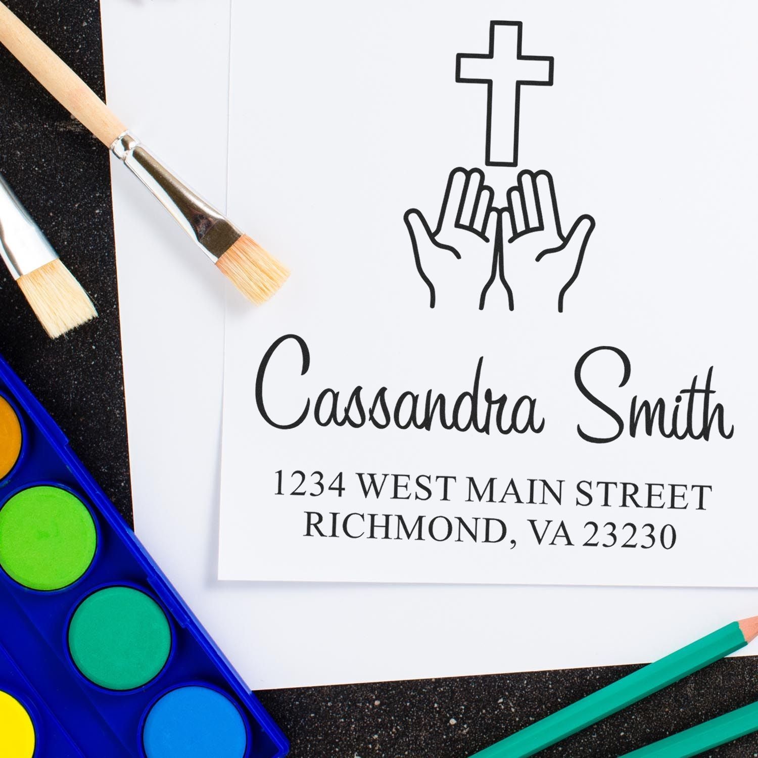 Custom Christian return address rubber stamp with cross and praying hands for Cassondra Smith, Richmond, VA.