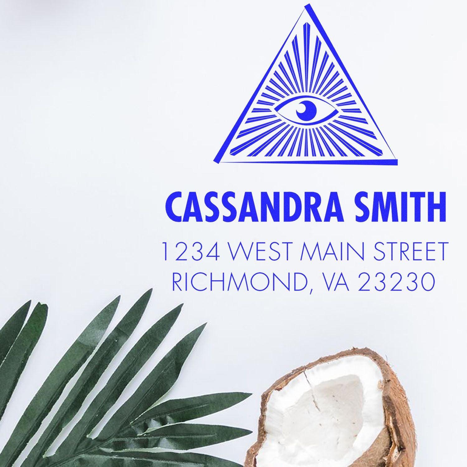 Custom rubber address stamp with blue pyramid eye logo, Cassandra Smith name, and Richmond, VA 23230 return address.