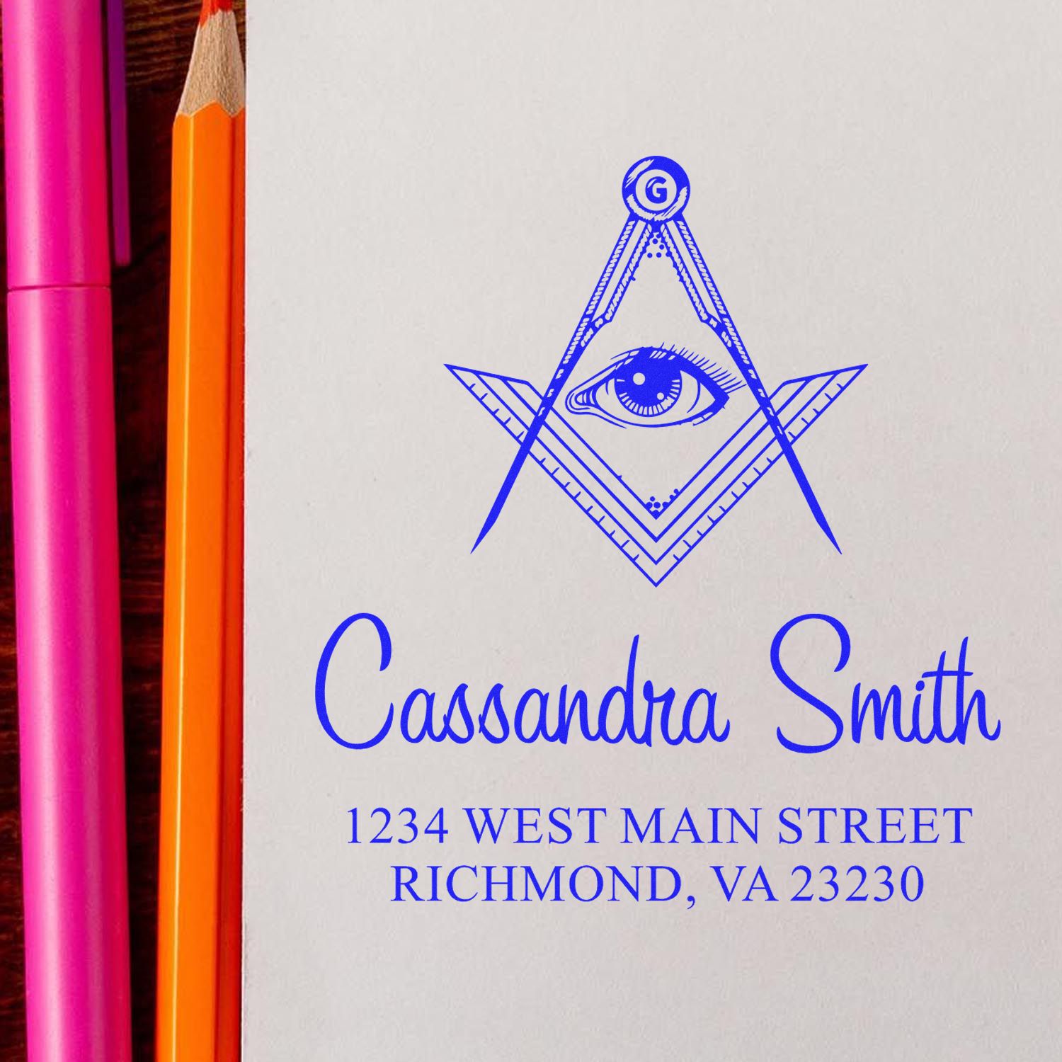 Personalized return address rubber stamp featuring compass eye logo, Cassandra Smith, Richmond VA 23230.