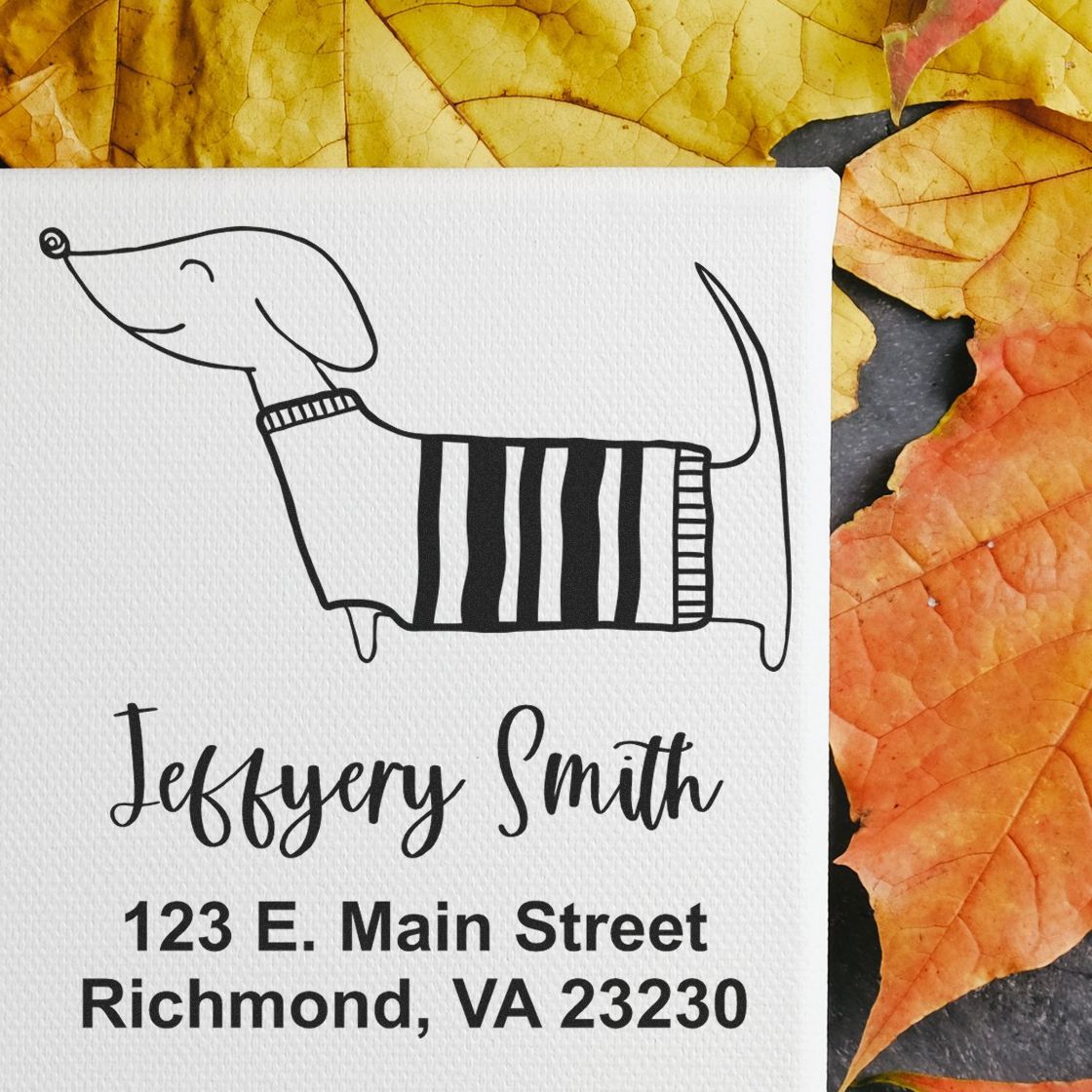 Custom dog address rubber stamp with name, street address and city state ZIP, featuring a whimsical sweater dog design.