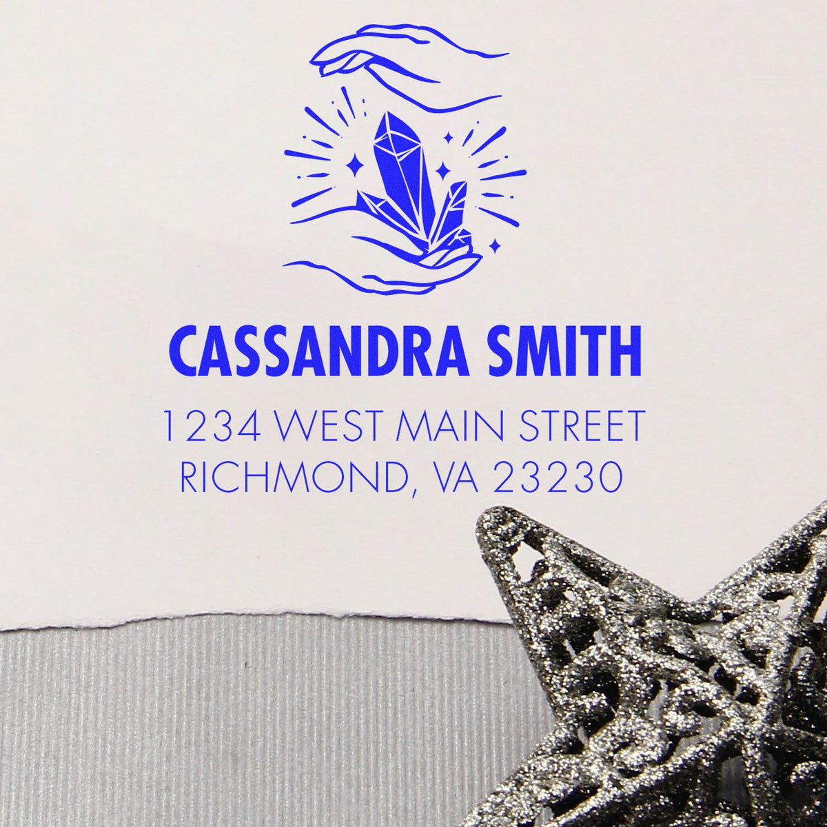 Custom rubber return address stamp with crystal logo for Cassandra Smith, 1234 West Main Street, Richmond, VA 23230.