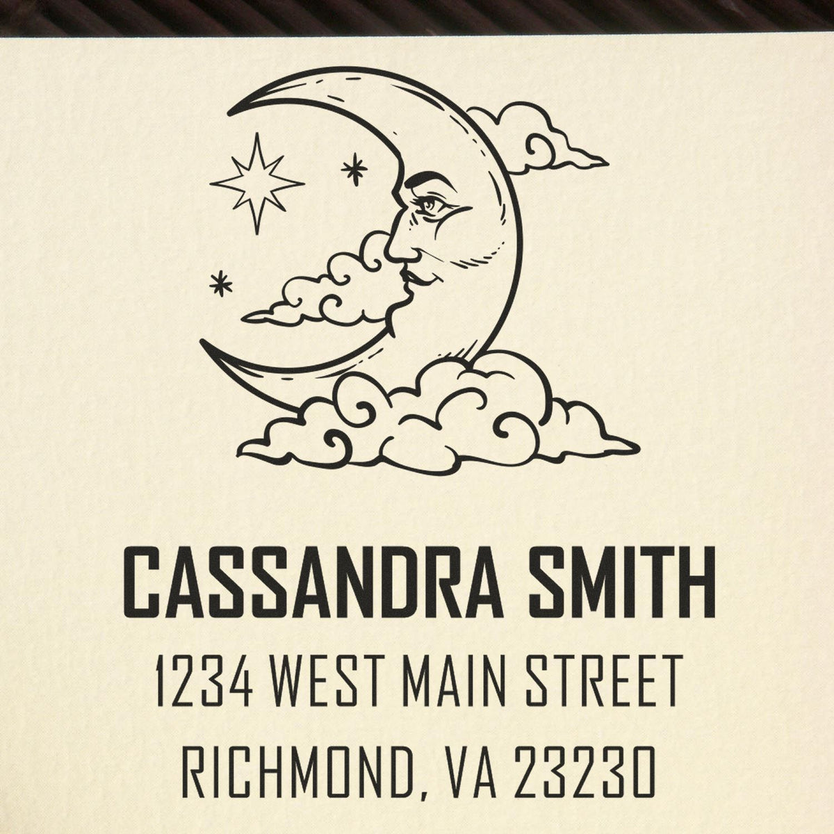 Personalized rubber address stamp with moon and stars for Cassandra Smith, 1234 West Main Street, Richmond, VA 23230