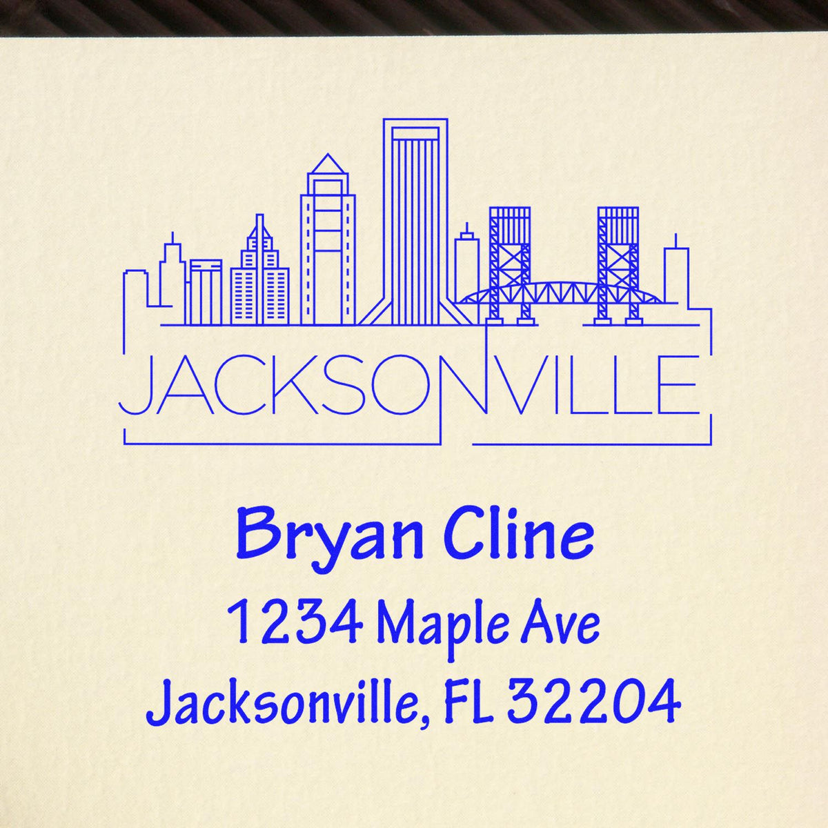 Custom personalized Jacksonville return address rubber stamp with skyline, Bryan Cline, 1234 Maple Ave, FL 32204.