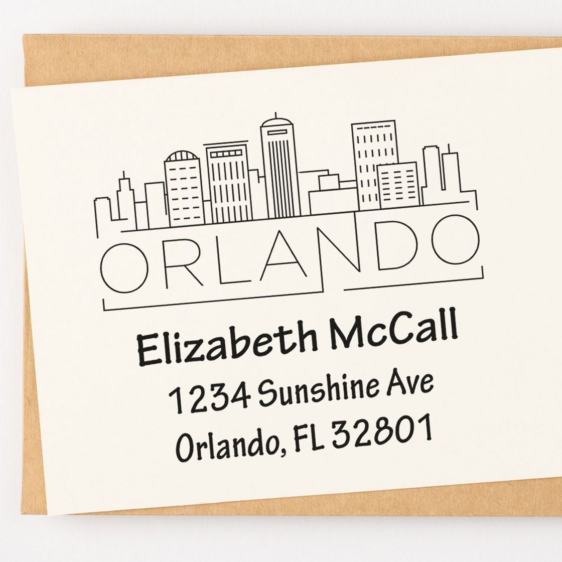 Custom Orlando return address rubber stamp with skyline design, featuring Elizabeth McCall, 1234 Sunshine Ave, Orlando, FL 32801.