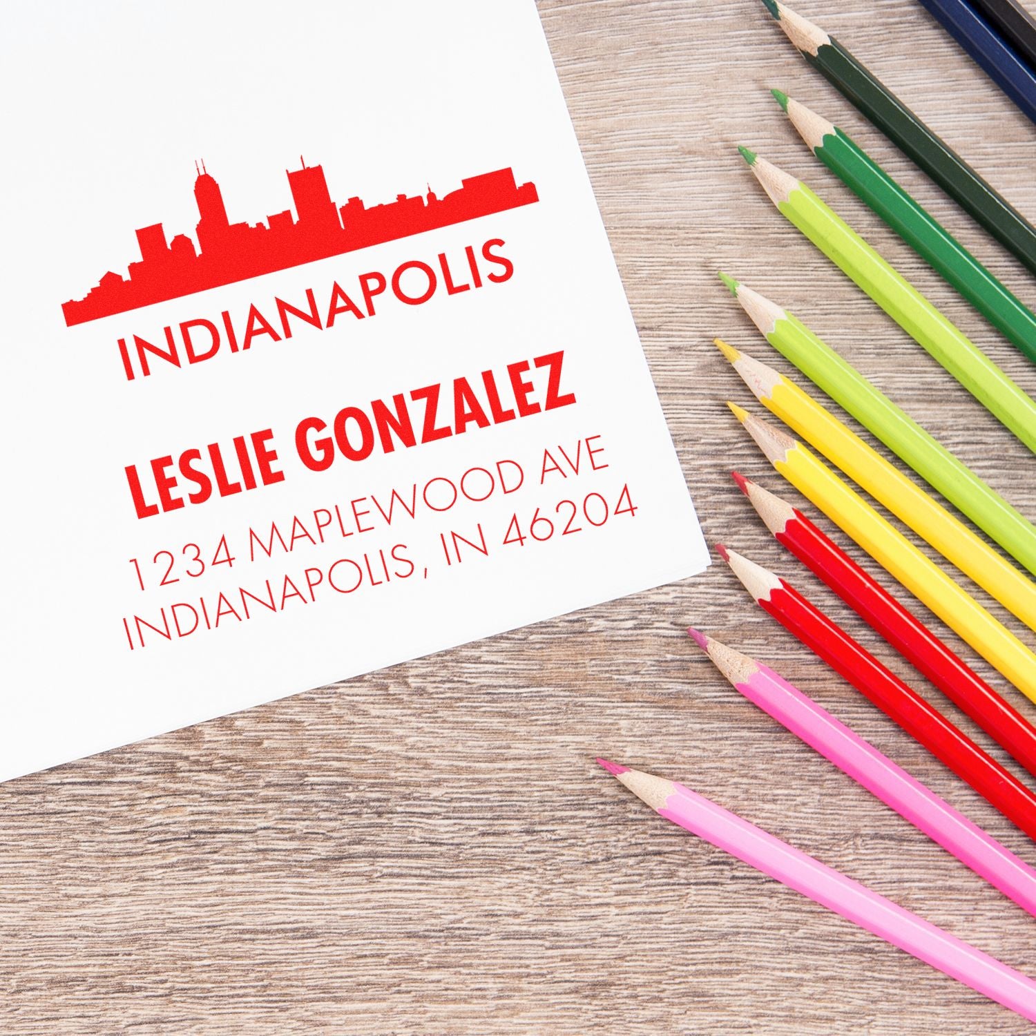 Custom Indianapolis address rubber stamp for Leslie Gonzalez, featuring skyline design on stationery