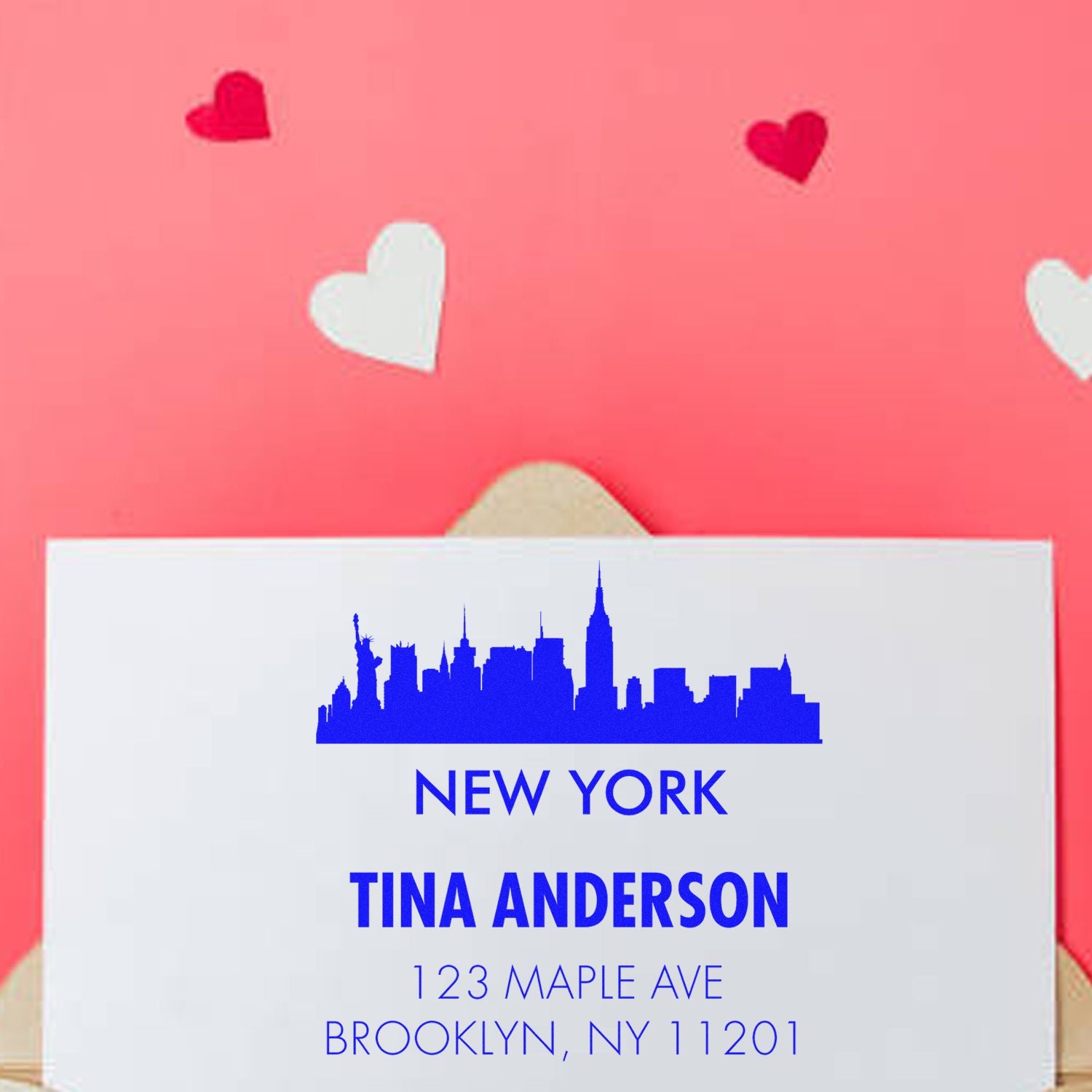 Custom New York address rubber stamp with skyline, Tina Anderson name, and Brooklyn return address for stationery.