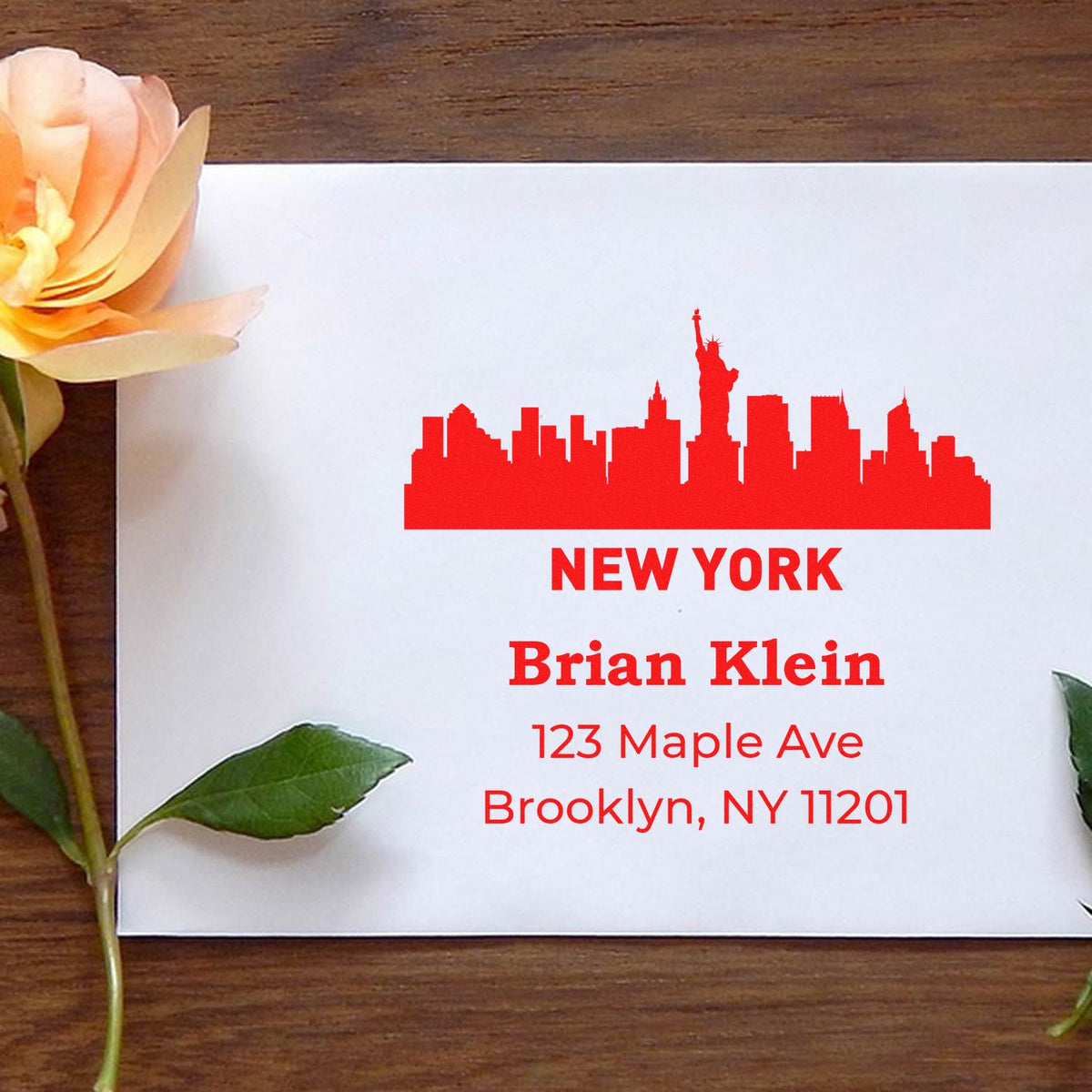 Personalized New York skyline return address rubber stamp for Brian Klein, Brooklyn, NY 11201 on a white envelope.