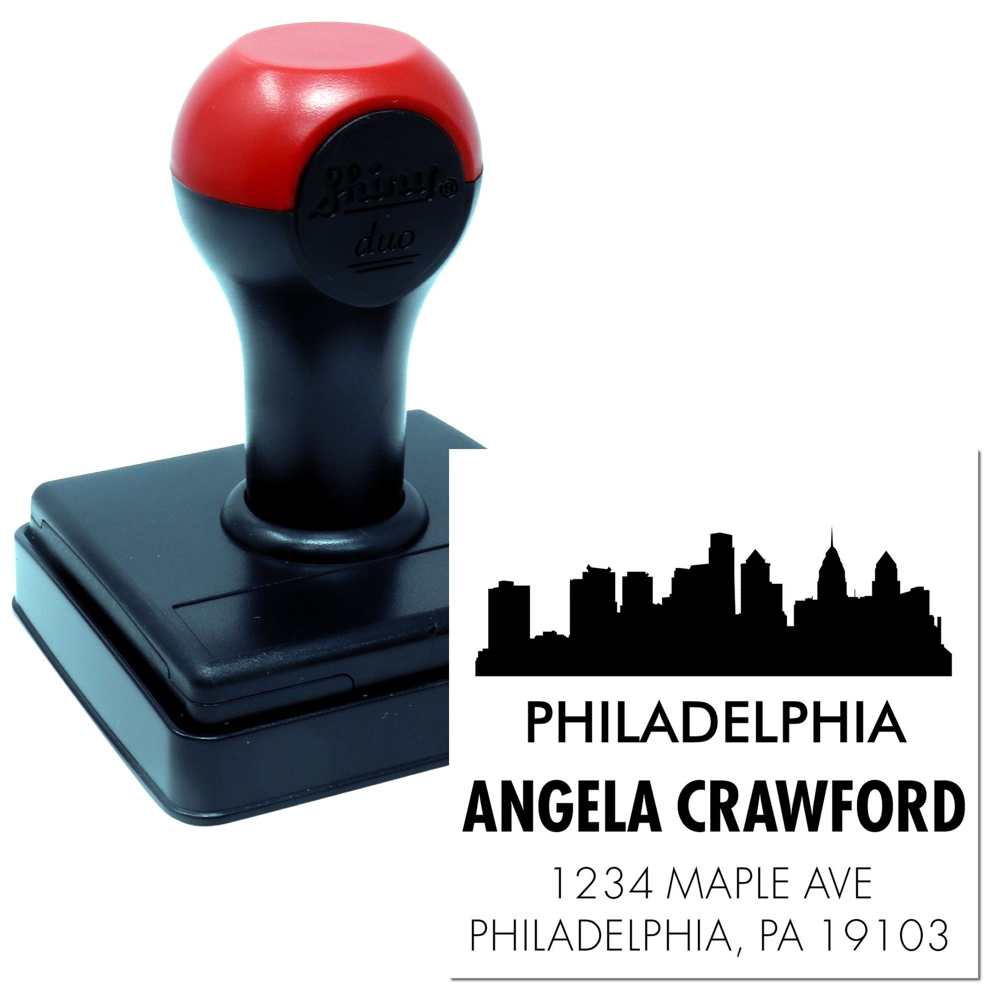 Custom self-inking rubber address stamp with Philadelphia skyline, Angela Crawford name, and 1234 Maple Ave for mailing use.