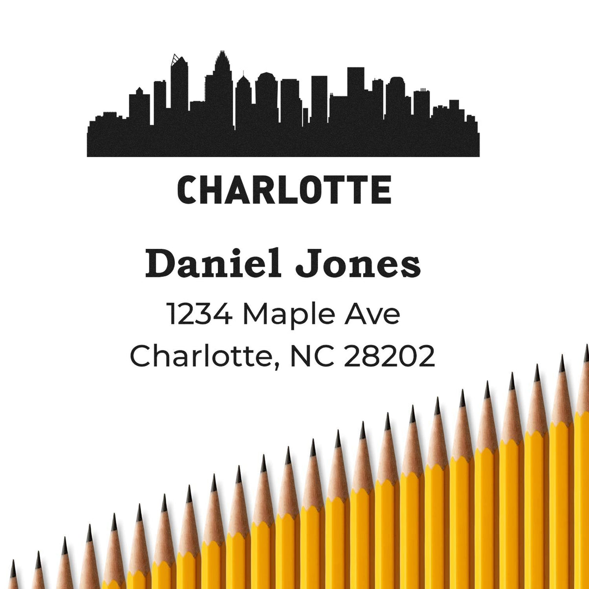 Custom Charlotte address rubber stamp with skyline, Daniel Jones, 1234 Maple Ave, Charlotte, NC 28202.