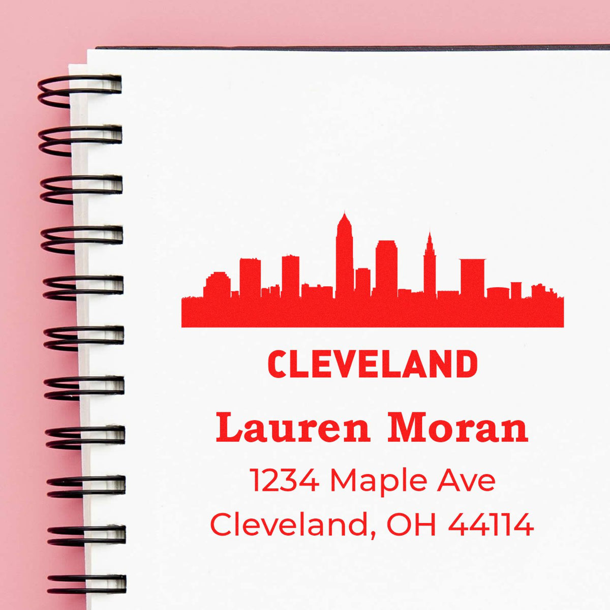 Custom Cleveland rubber stamp with skyline, Lauren Moran return address, 1234 Maple Ave, Cleveland, OH 44114.