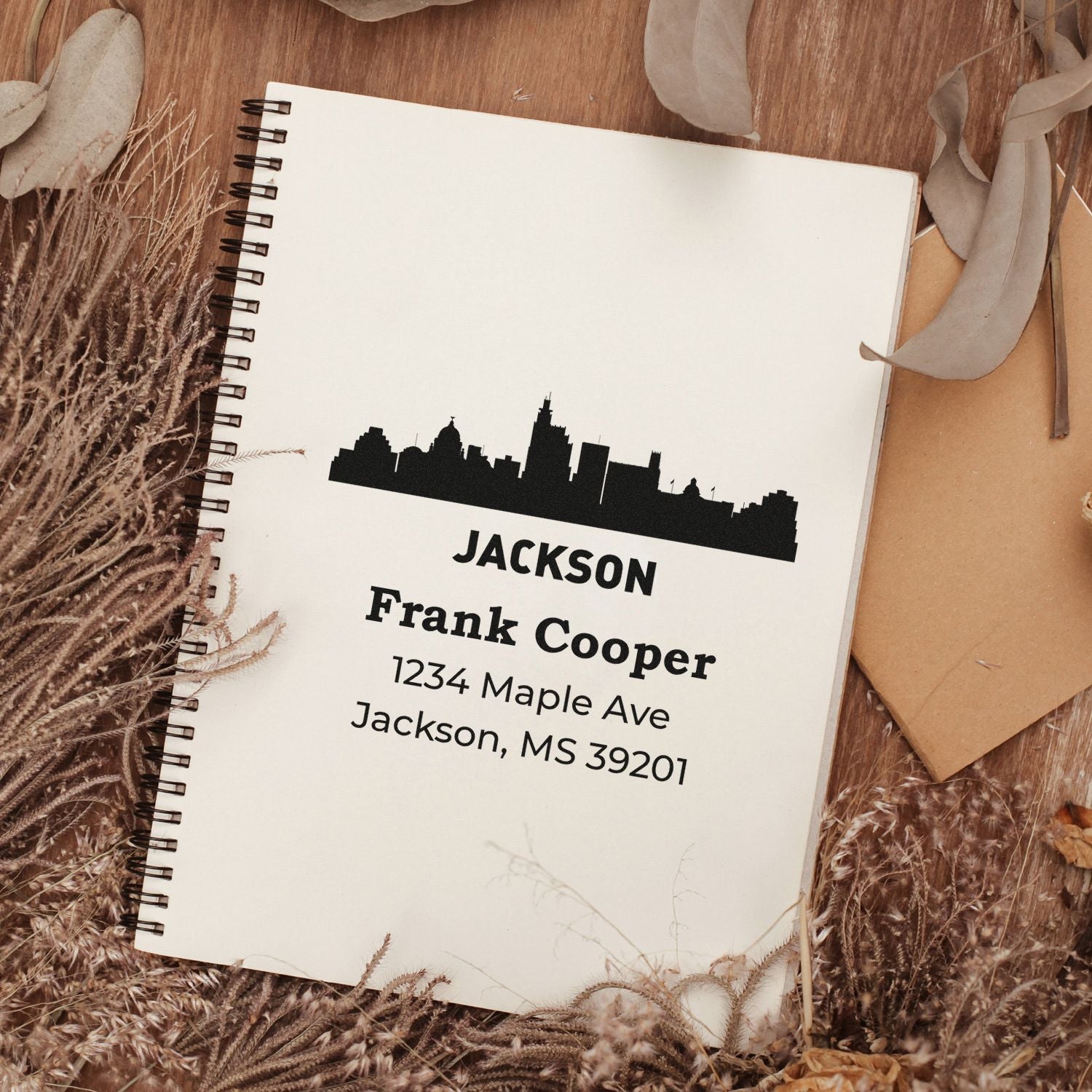 Custom Jackson skyline rubber stamp with Frank Cooper name and Mississippi address for personalized stationery.