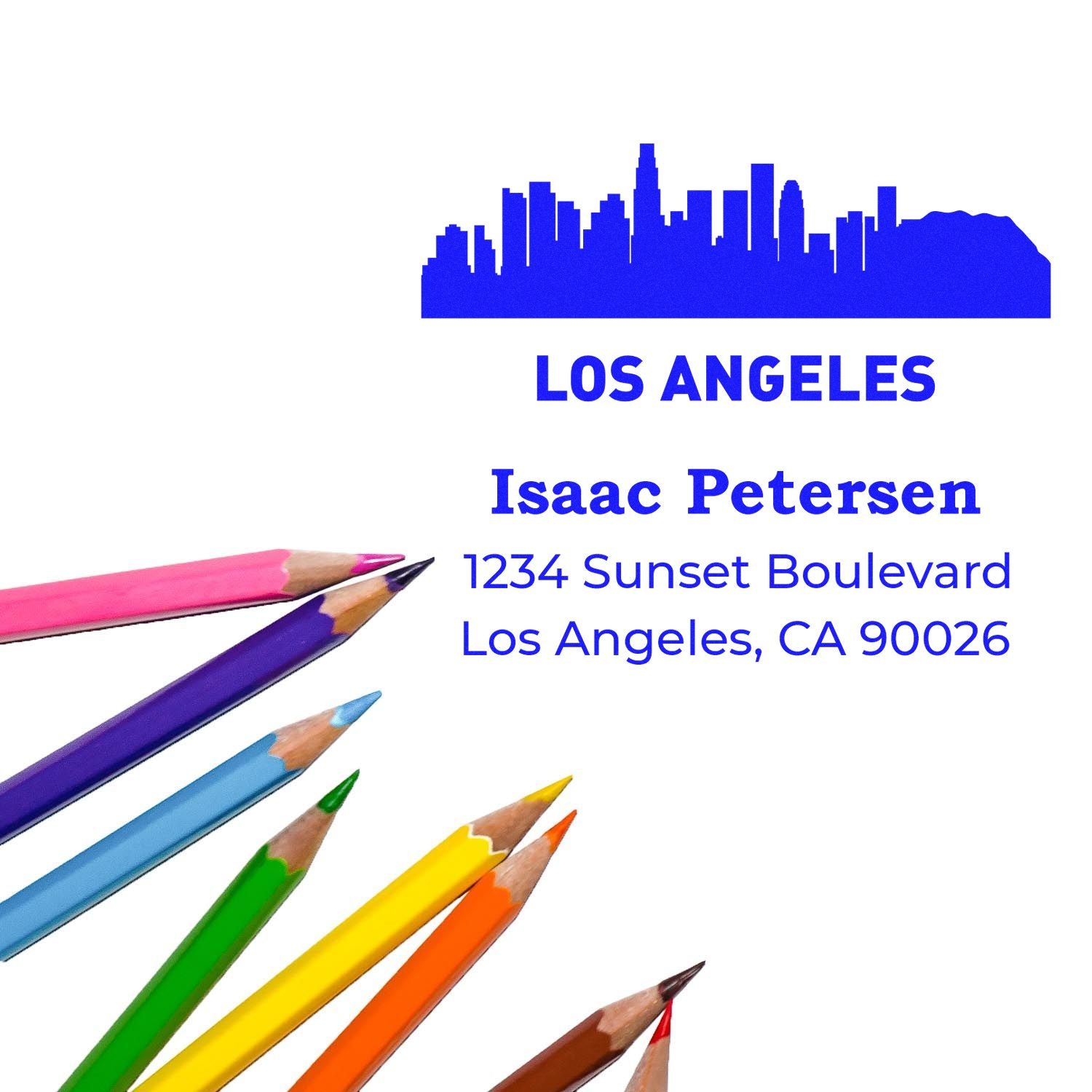 Custom Los Angeles return address rubber stamp for Isaac Petersen, featuring skyline graphic and colored pencils for school use.