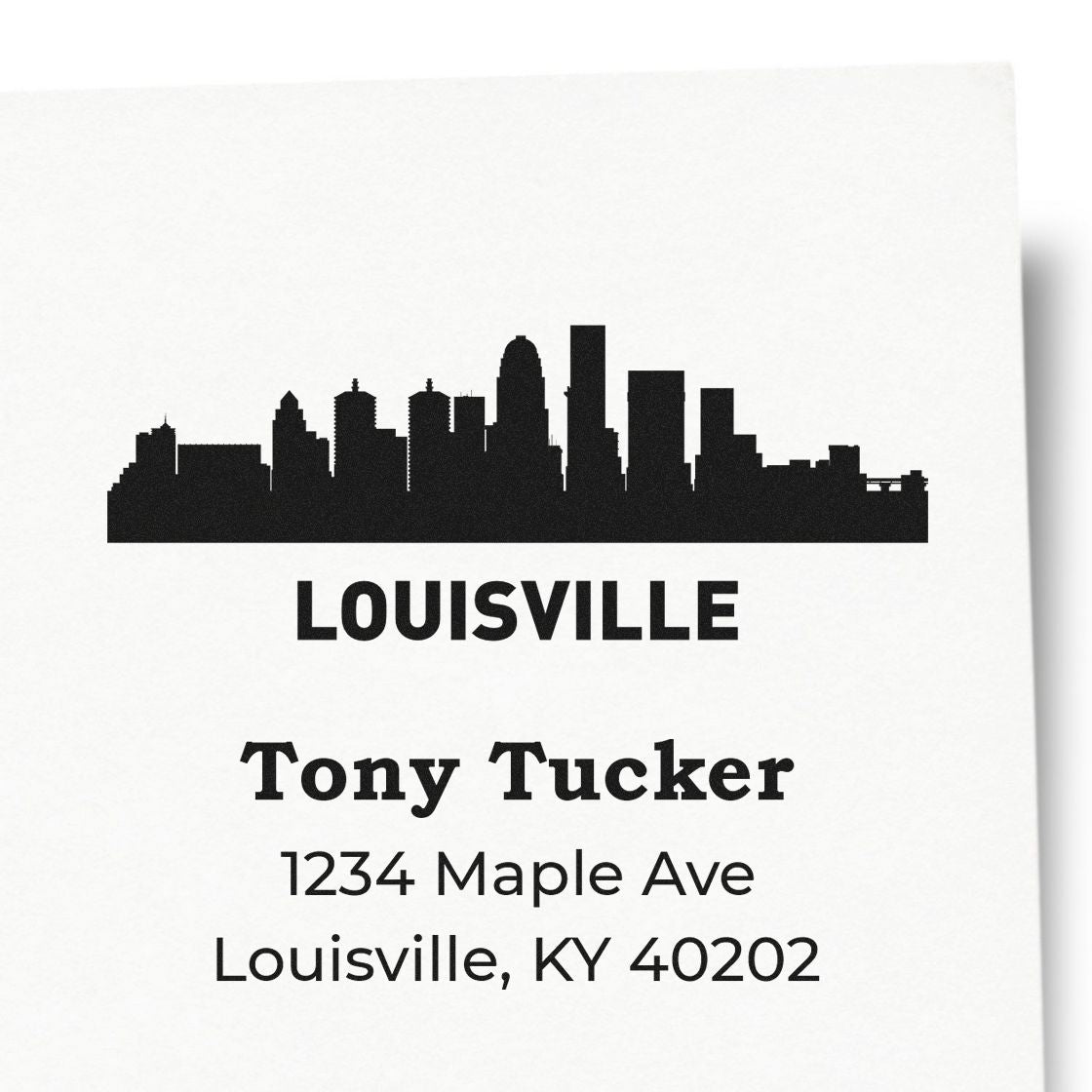 Custom Louisville skyline return address rubber stamp for Tony Tucker, 1234 Maple Ave, Louisville, KY 40202.