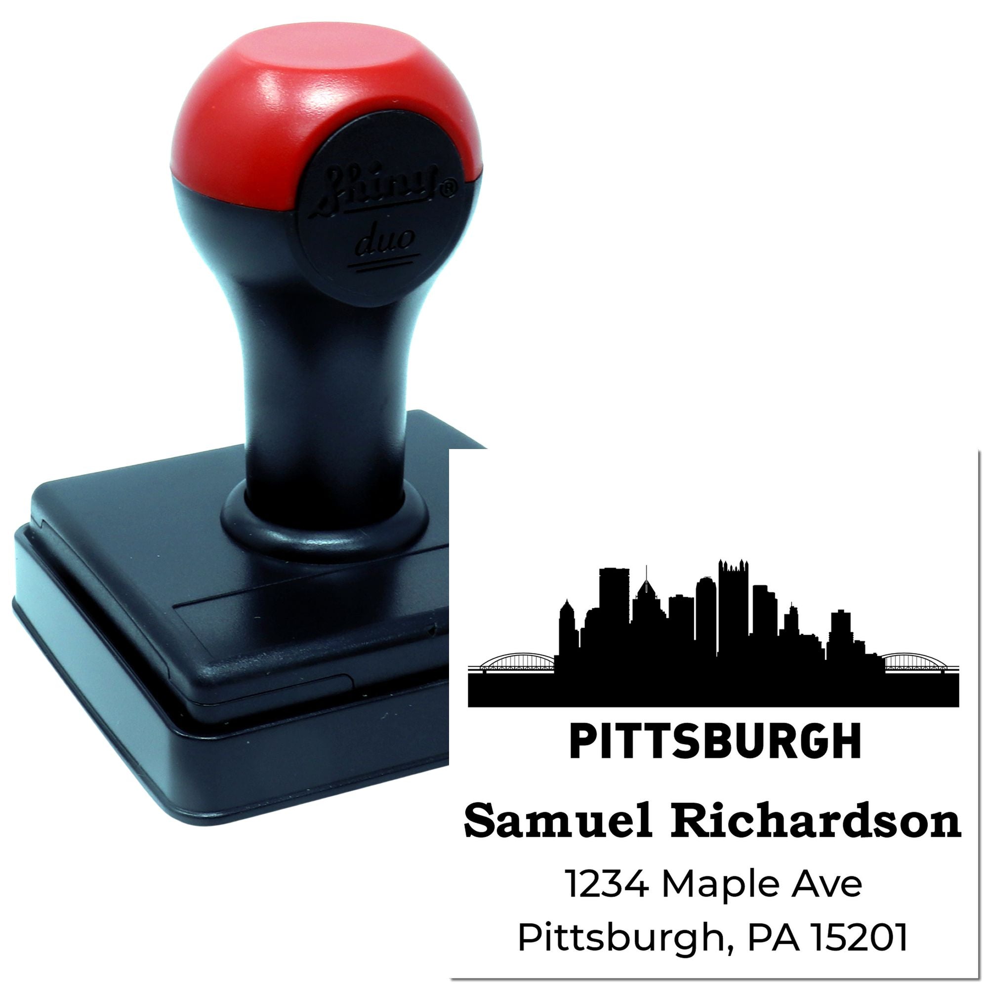 Custom self-inking rubber address stamp with Pittsburgh skyline and name for personalized mailing envelopes.