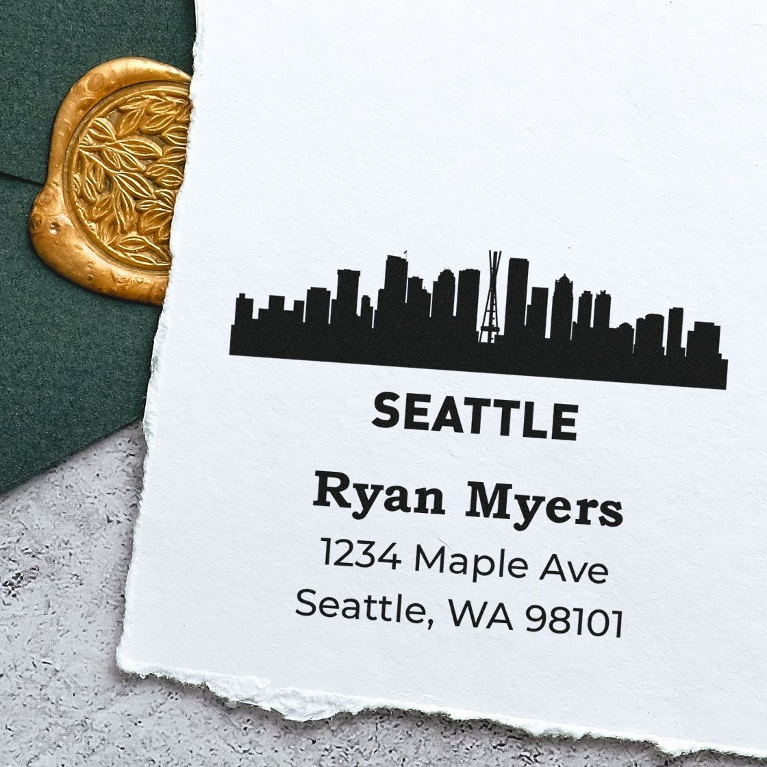 Custom Seattle skyline return address rubber stamp with name, street address, and ZIP code for personalized mailing.