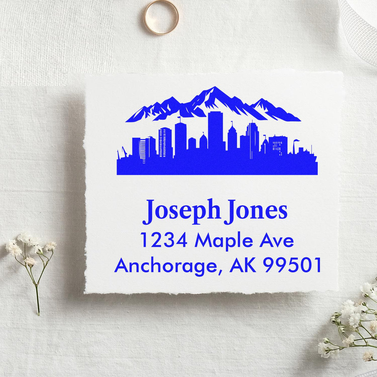 Personalized return address rubber stamp with Anchorage skyline and mountains for custom envelope mailing.