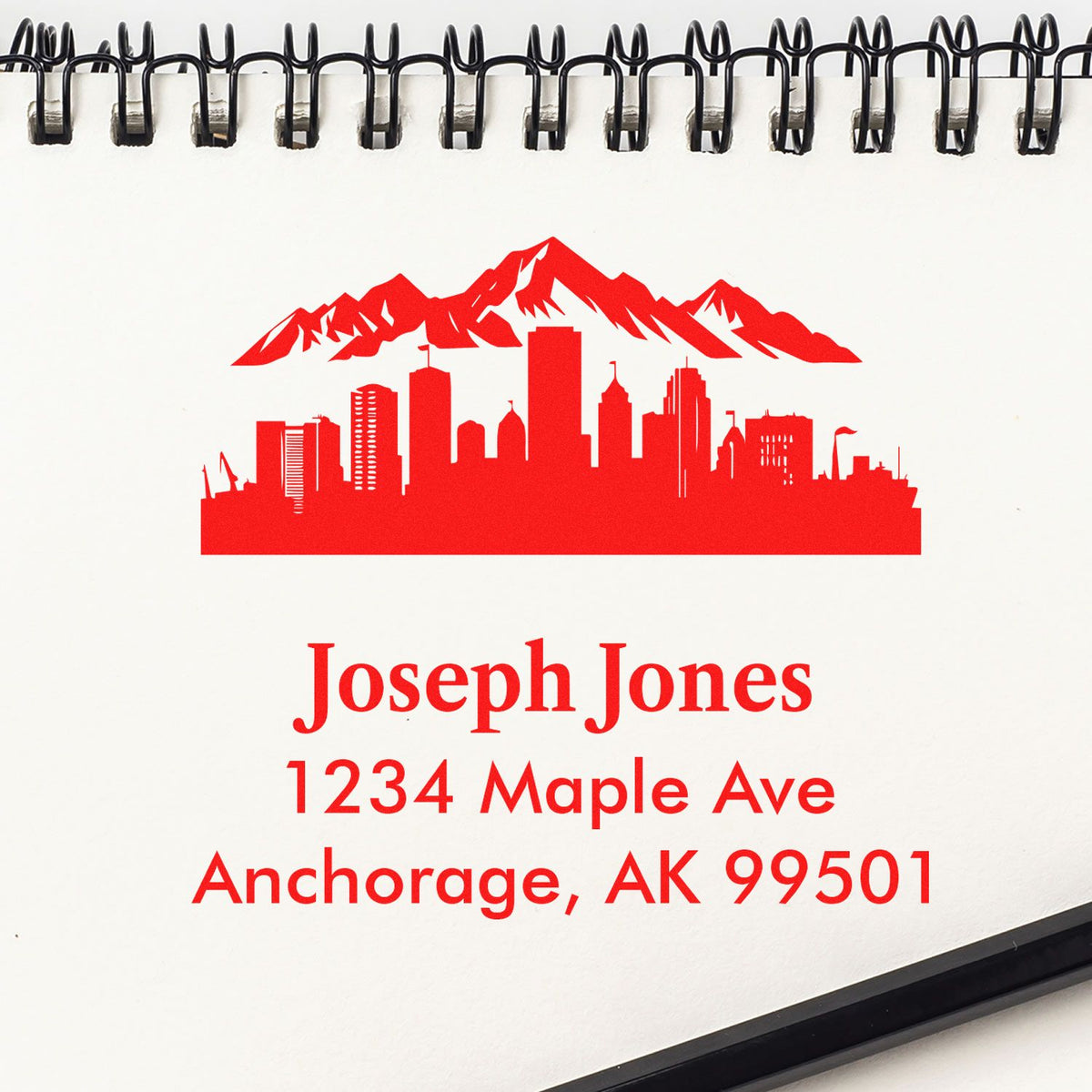 Custom rubber stamp with Anchorage skyline and personalized address for Joseph Jones, 1234 Maple Ave, Anchorage, AK 99501