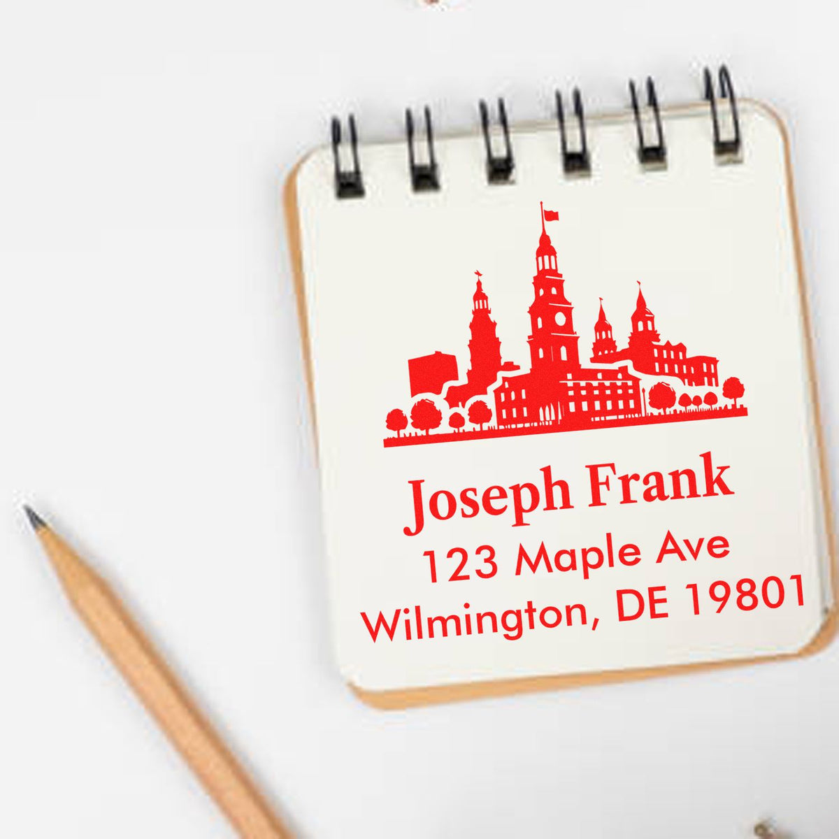Custom rubber stamp with city skyline and personalized address for Joseph Frank, Wilmington, DE 19801