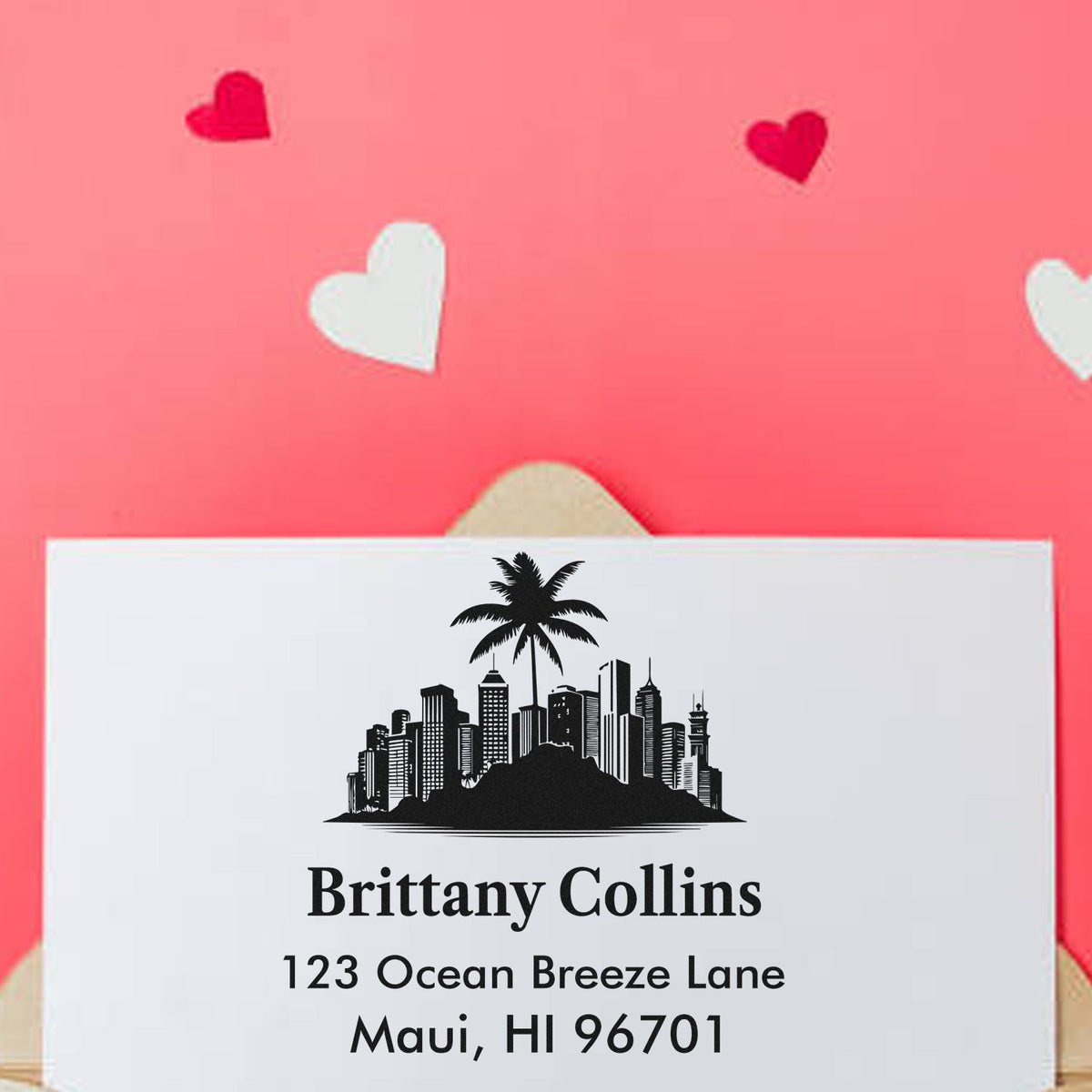 Custom rubber return address stamp with tropical skyline and palm tree, personalized for Brittany Collins, Maui, HI 96701