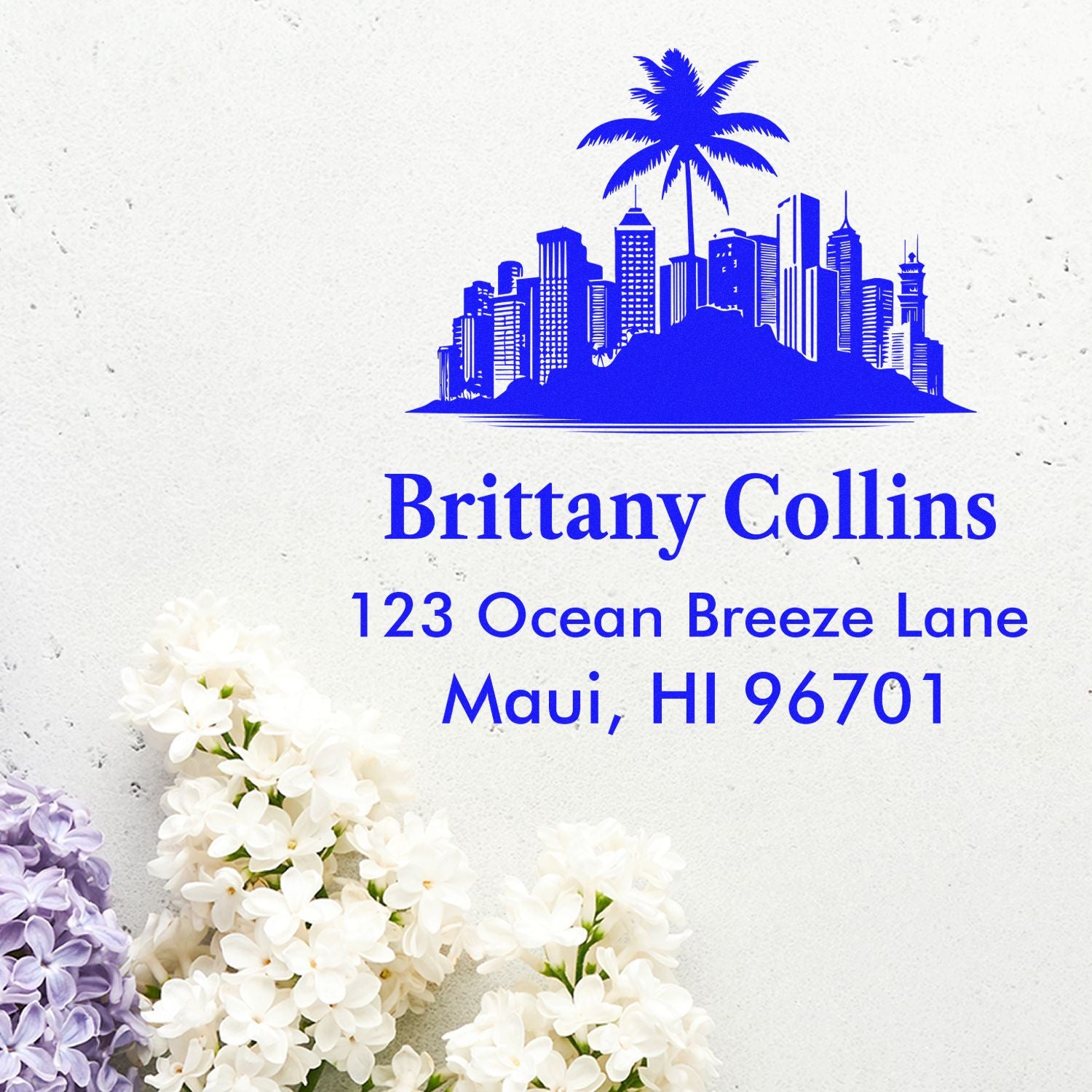 Custom return address rubber stamp with blue palm tree skyline for Brittany Collins, 123 Ocean Breeze Lane, Maui, HI 96701.
