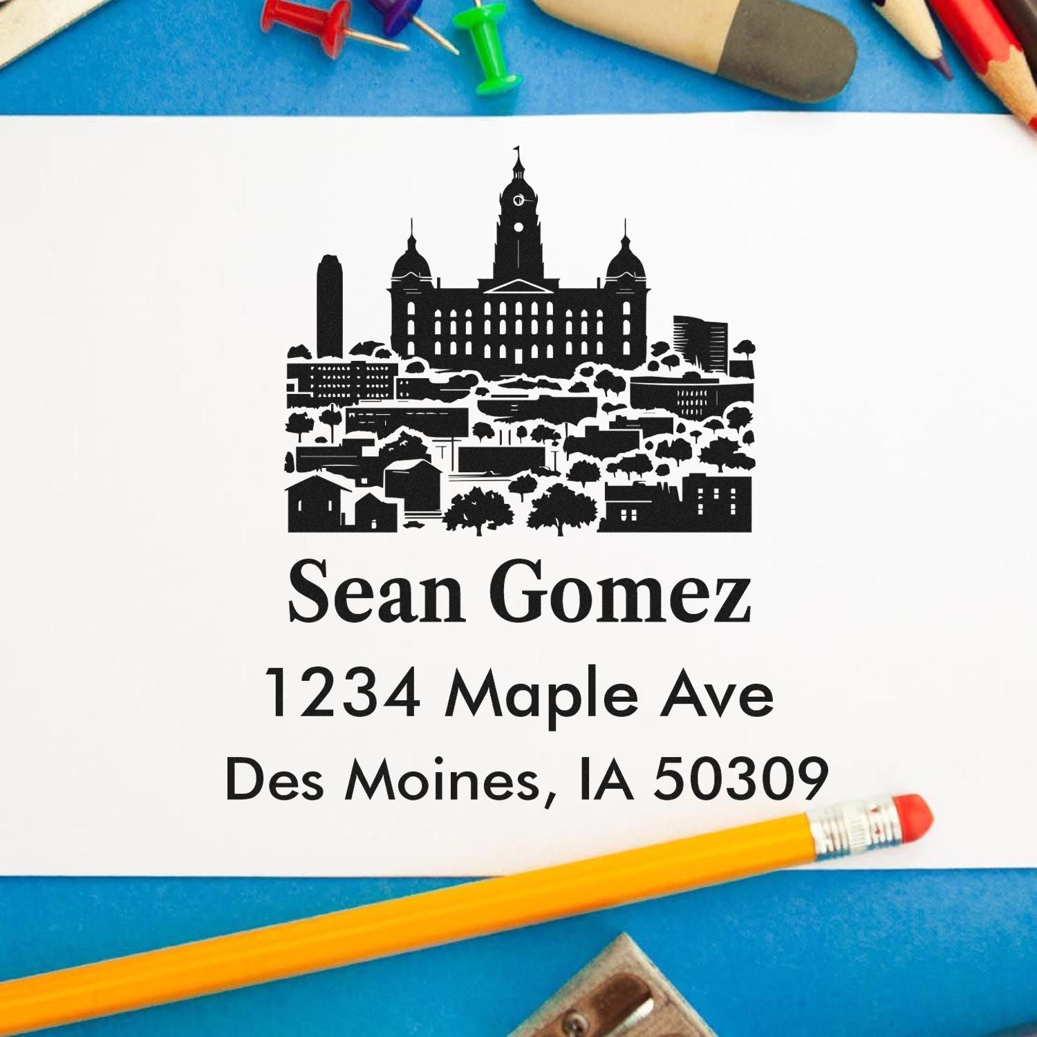Personalized address rubber stamp design with Des Moines skyline, Sean Gomez, 1234 Maple Ave, Des Moines, IA 50309.