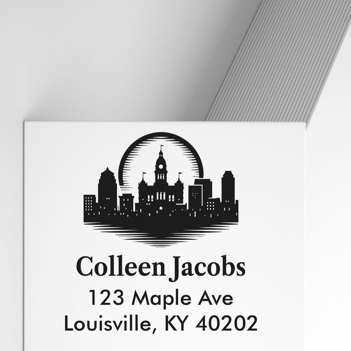 Custom return address rubber stamp with Louisville skyline for Colleen Jacobs, 123 Maple Ave, Louisville, KY 40202