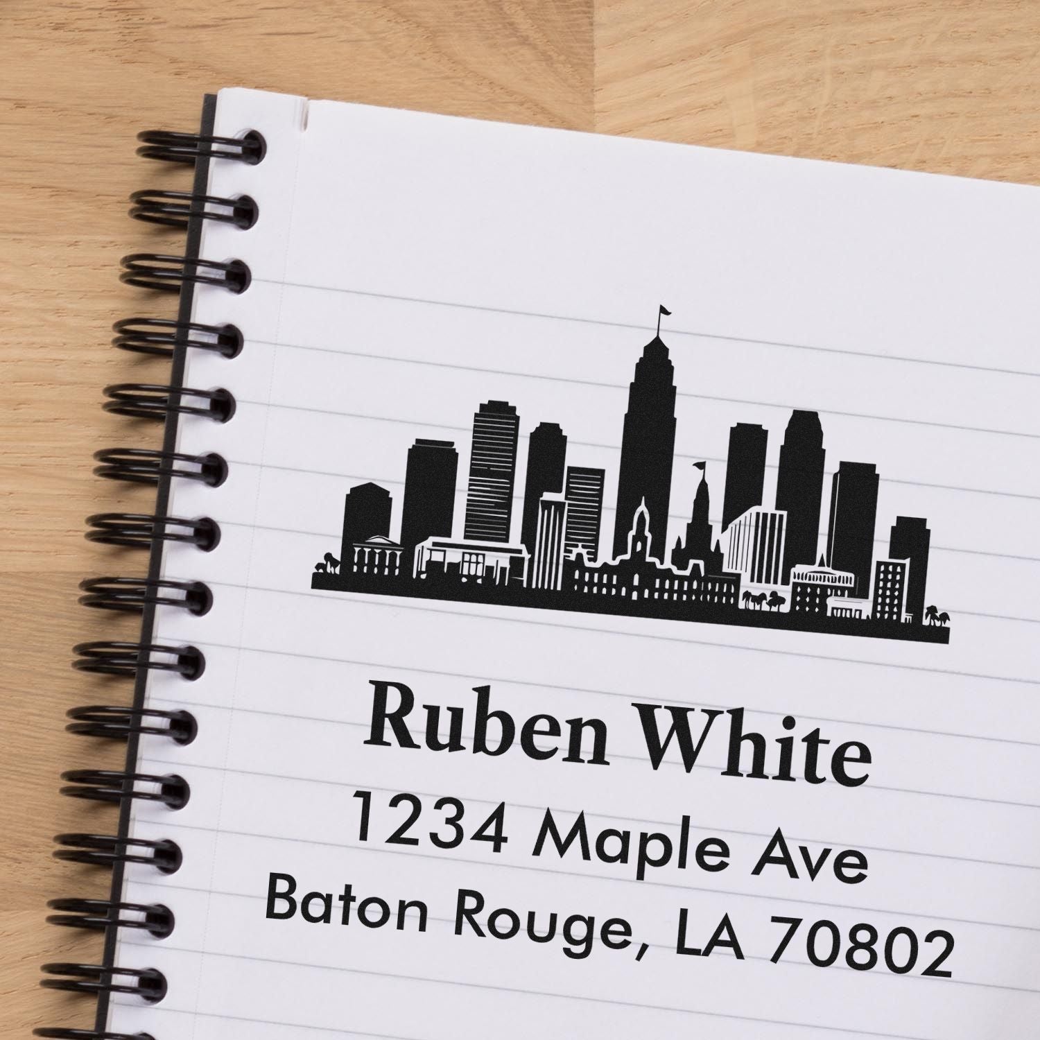 Personalized city skyline address rubber stamp for Ruben White, 1234 Maple Ave, Baton Rouge, LA 70802