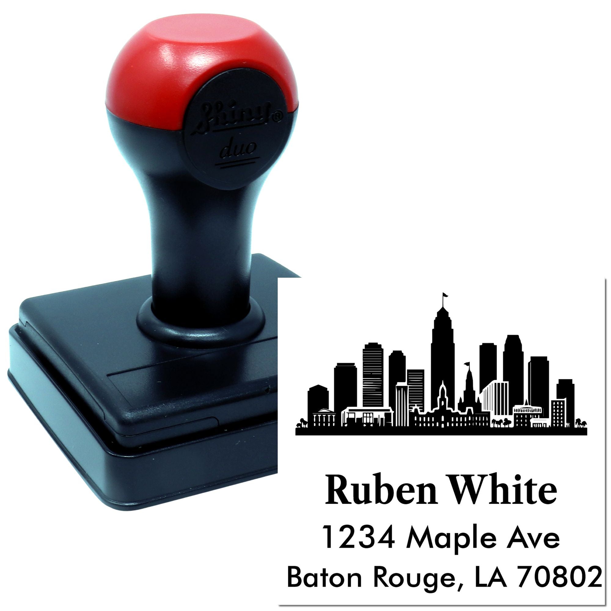 Custom self-inking rubber stamp with skyline logo and return address imprint for business mailings.