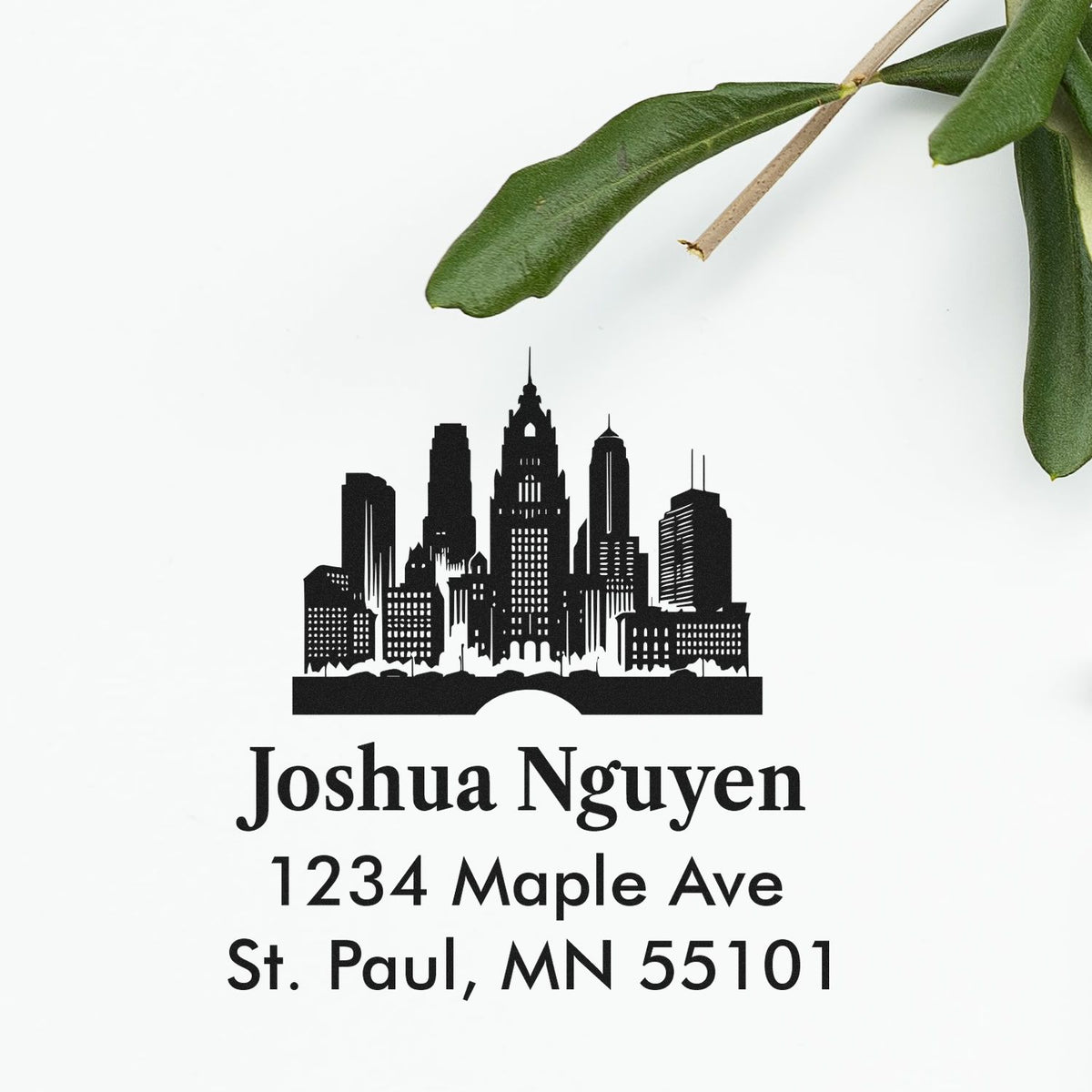 Custom return address rubber stamp with skyline design, Joshua Nguyen name, and St. Paul, MN 55101 mailing address.