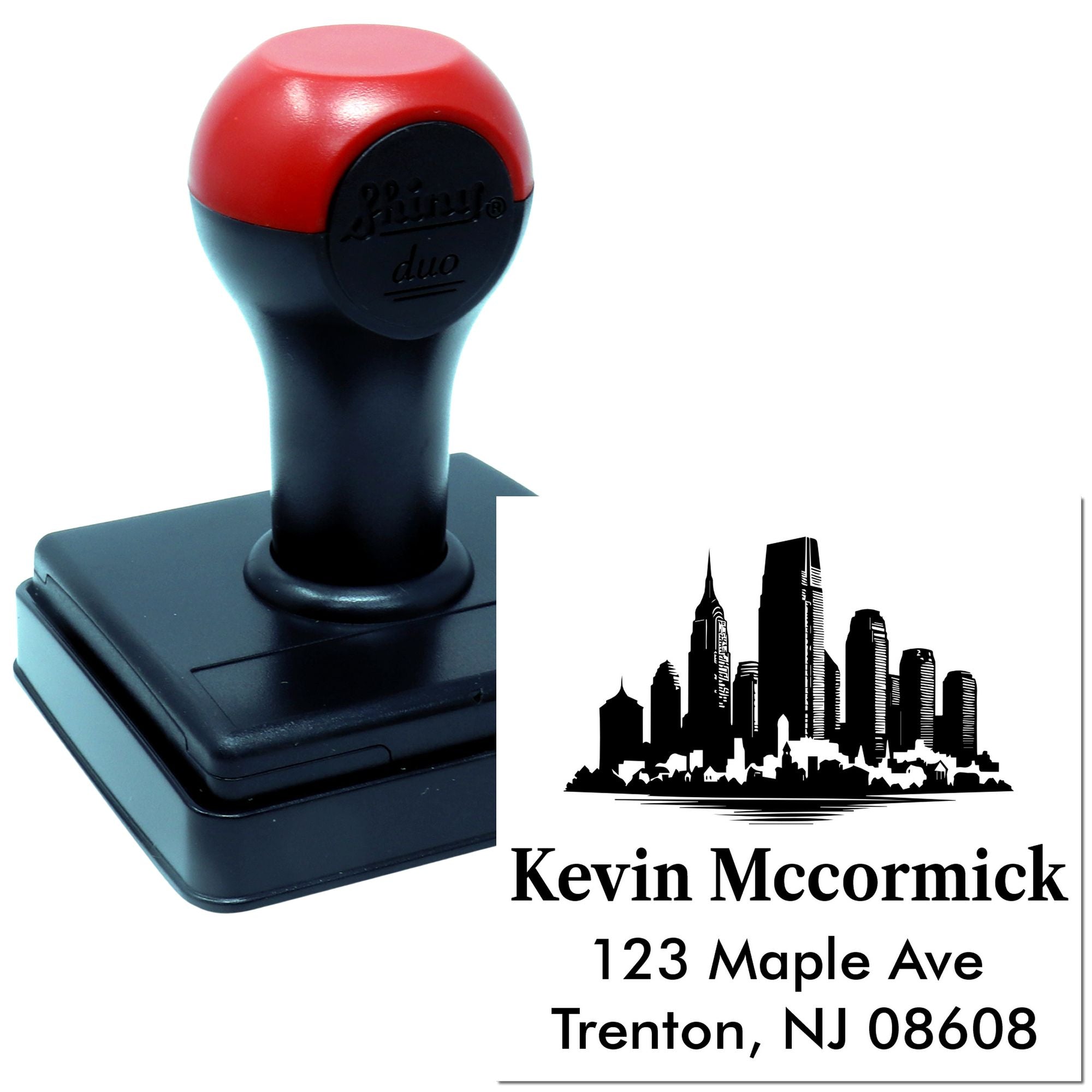 Custom self-inking rubber address stamp with skyline design and sample imprint for Kevin McCormick.