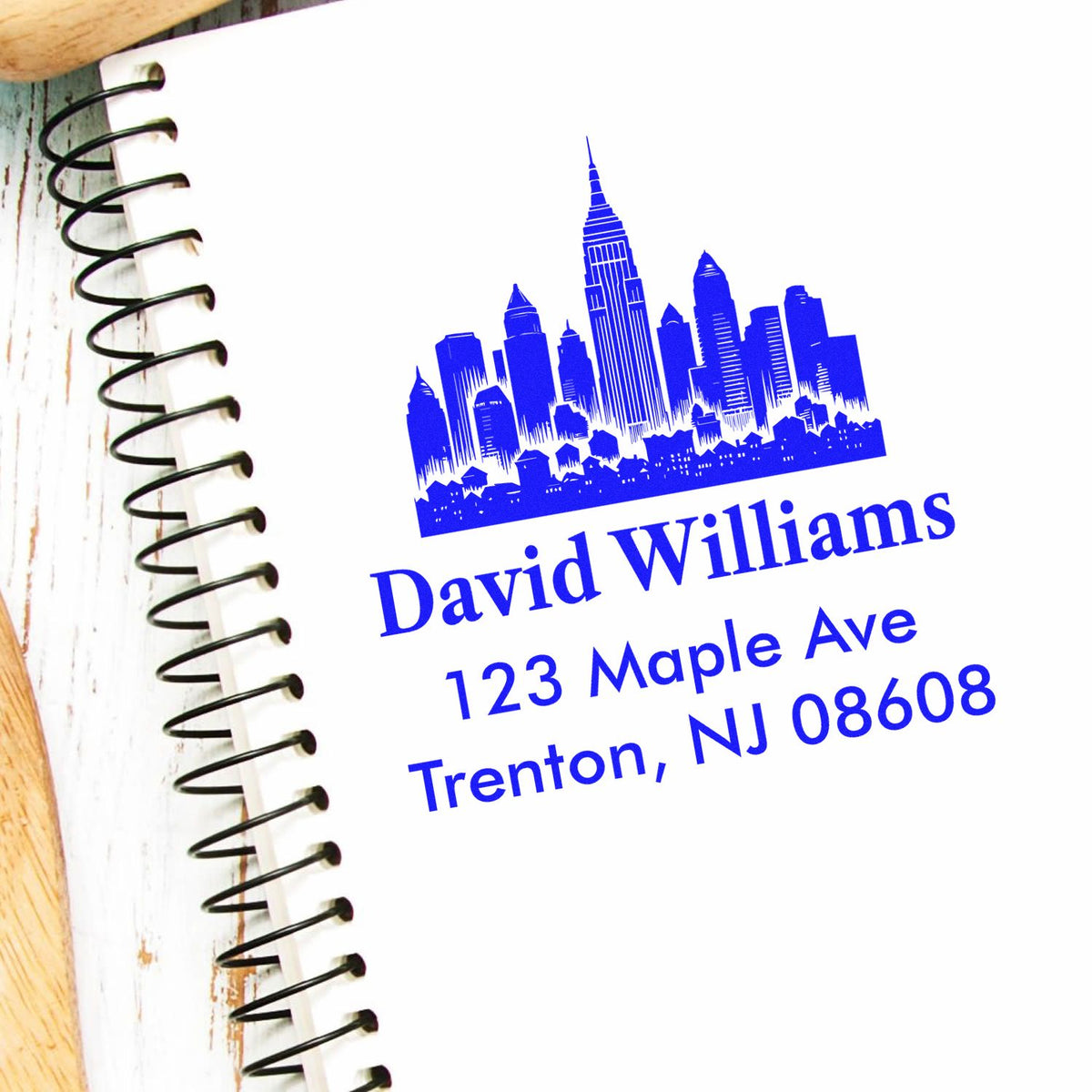 Personalized address rubber stamp with skyline logo for David Williams, 123 Maple Ave, Trenton, NJ 08608.