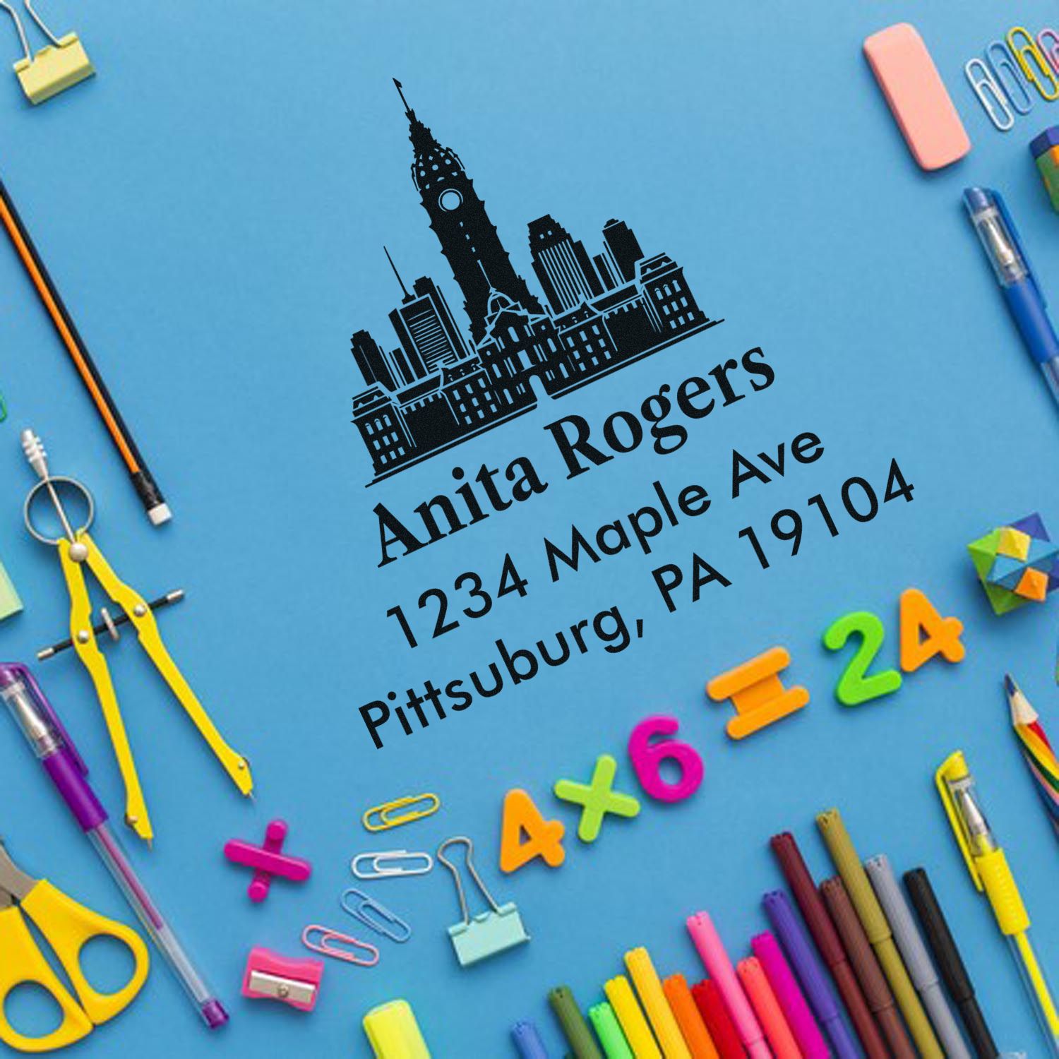 Custom address rubber stamp with Pittsburgh skyline for Anita Rogers, 1234 Maple Ave, Pittsburgh, PA 19104.