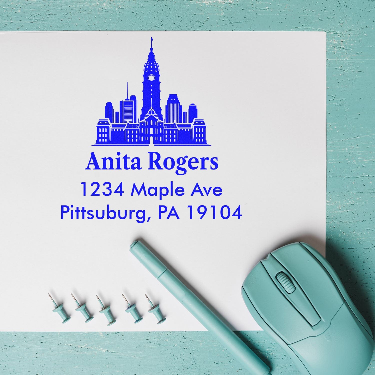 Custom Pittsburgh skyline return address rubber stamp for Anita Rogers, 1234 Maple Ave, Pittsburg, PA 19104.