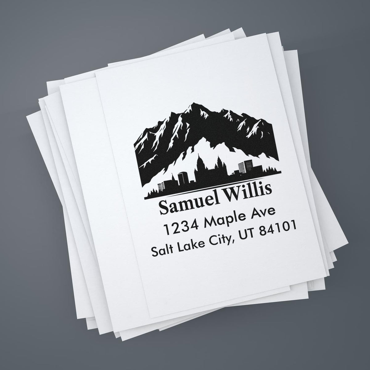Custom address rubber stamp with mountain logo for Samuel Willis, 1234 Maple Ave, Salt Lake City, UT 84101.